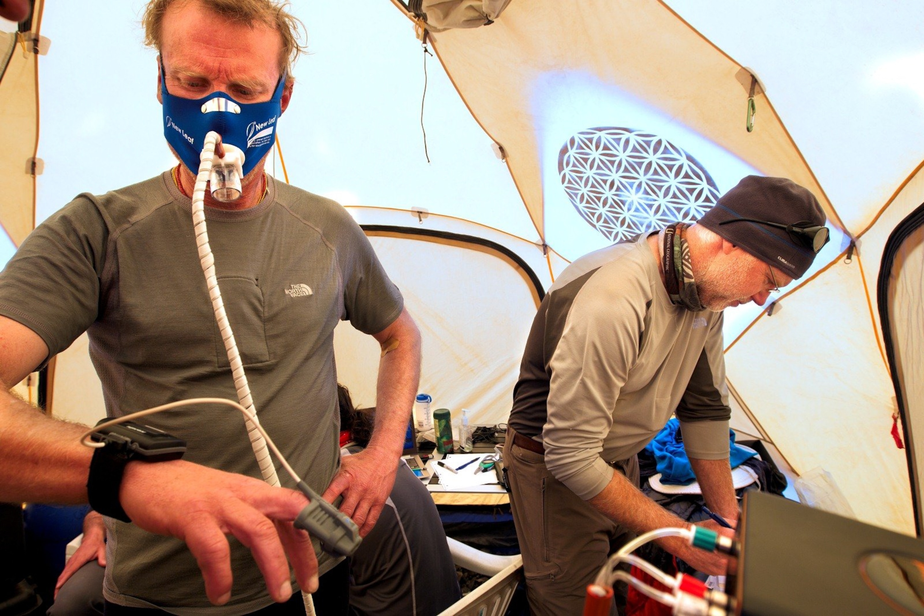 Bruce Miller tests Conrad Anker in base camp, using the step test, monitoring his O2 and CO2 levels