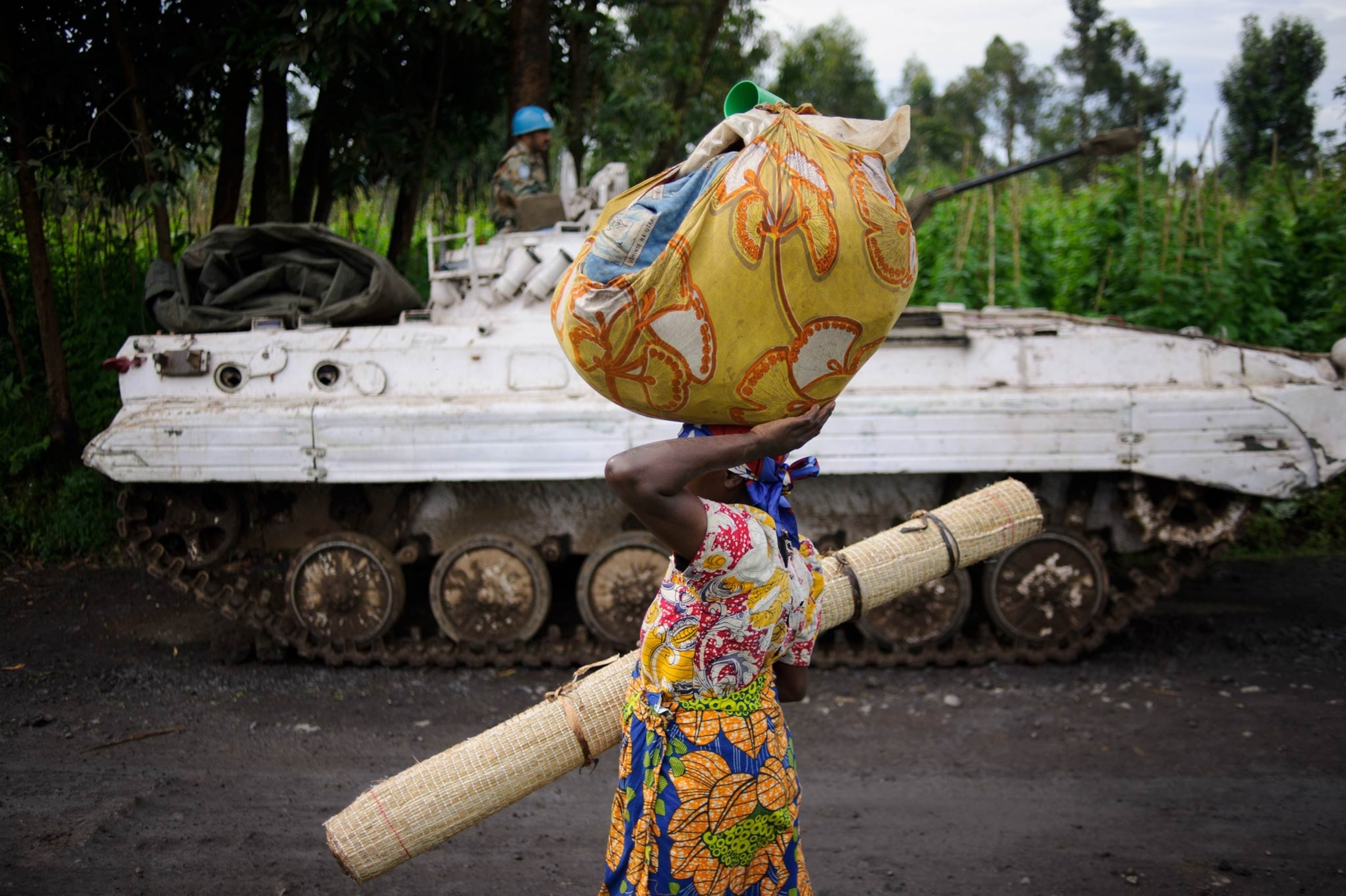 Congolese commandos celebrate as they advance up the mountainous road toward Bunagana, the last remaining stronghold of the M-23 rebels on Wednesday.(Pete Muller for the New York Times)