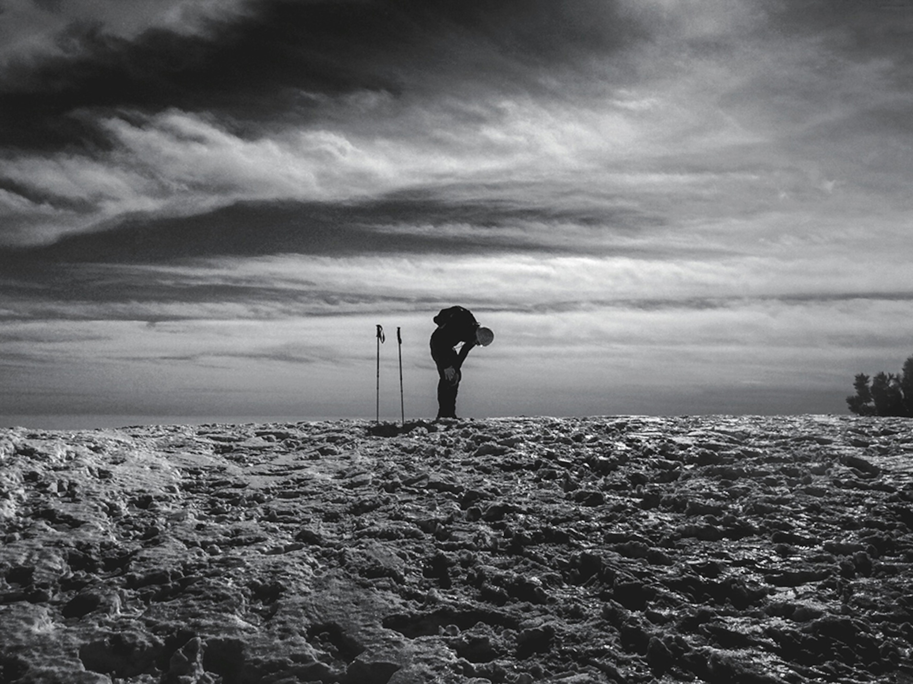 a skier at the top of hill