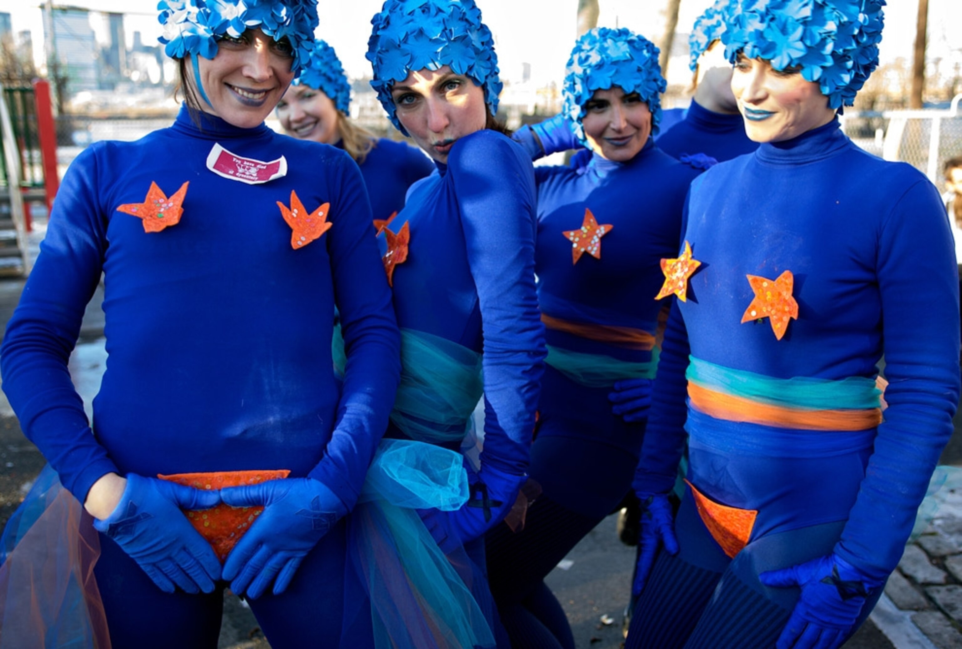 Women dressed in blue costumes and bathing caps
