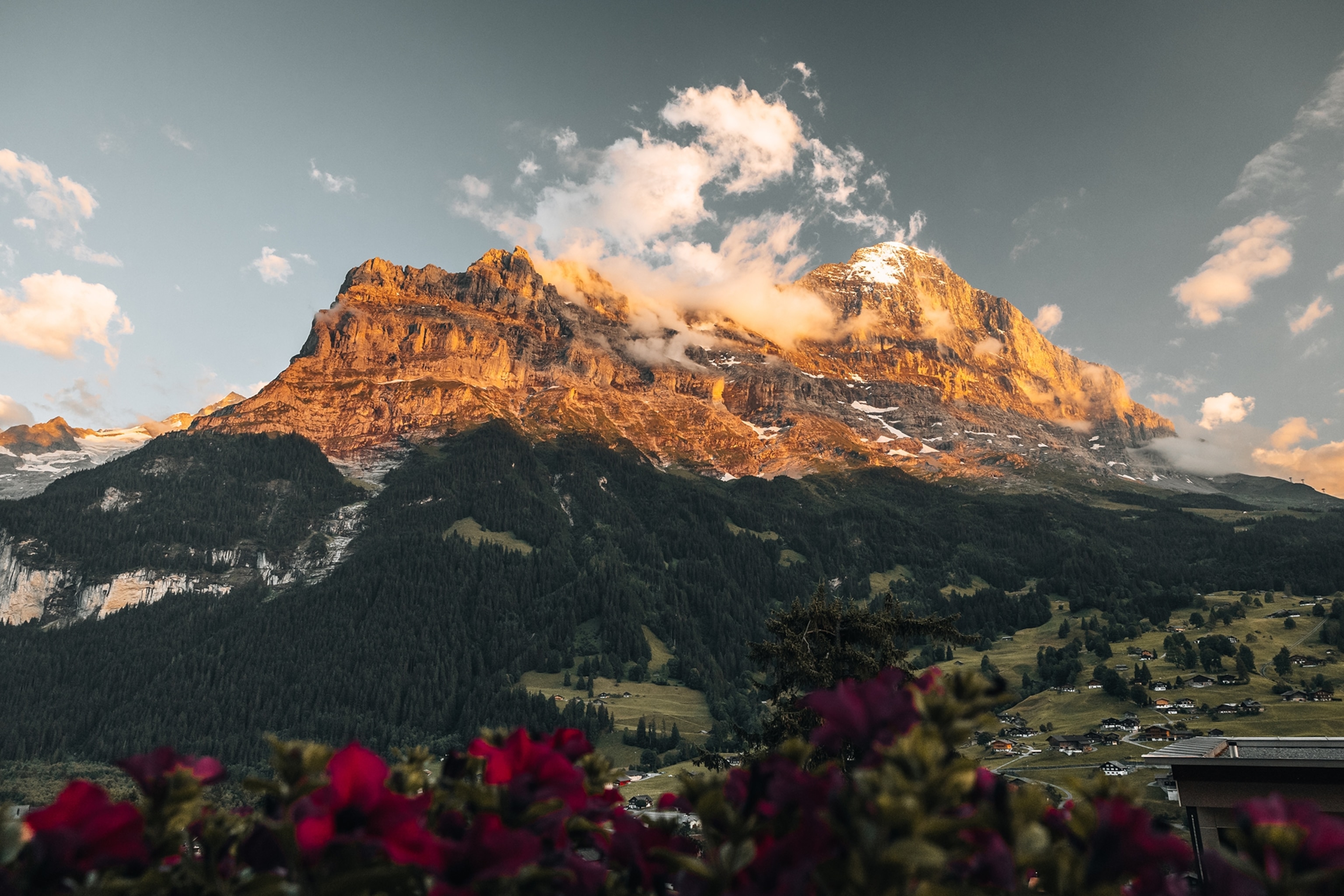 The rocky peaks of Mount Eiger glow at sunset.