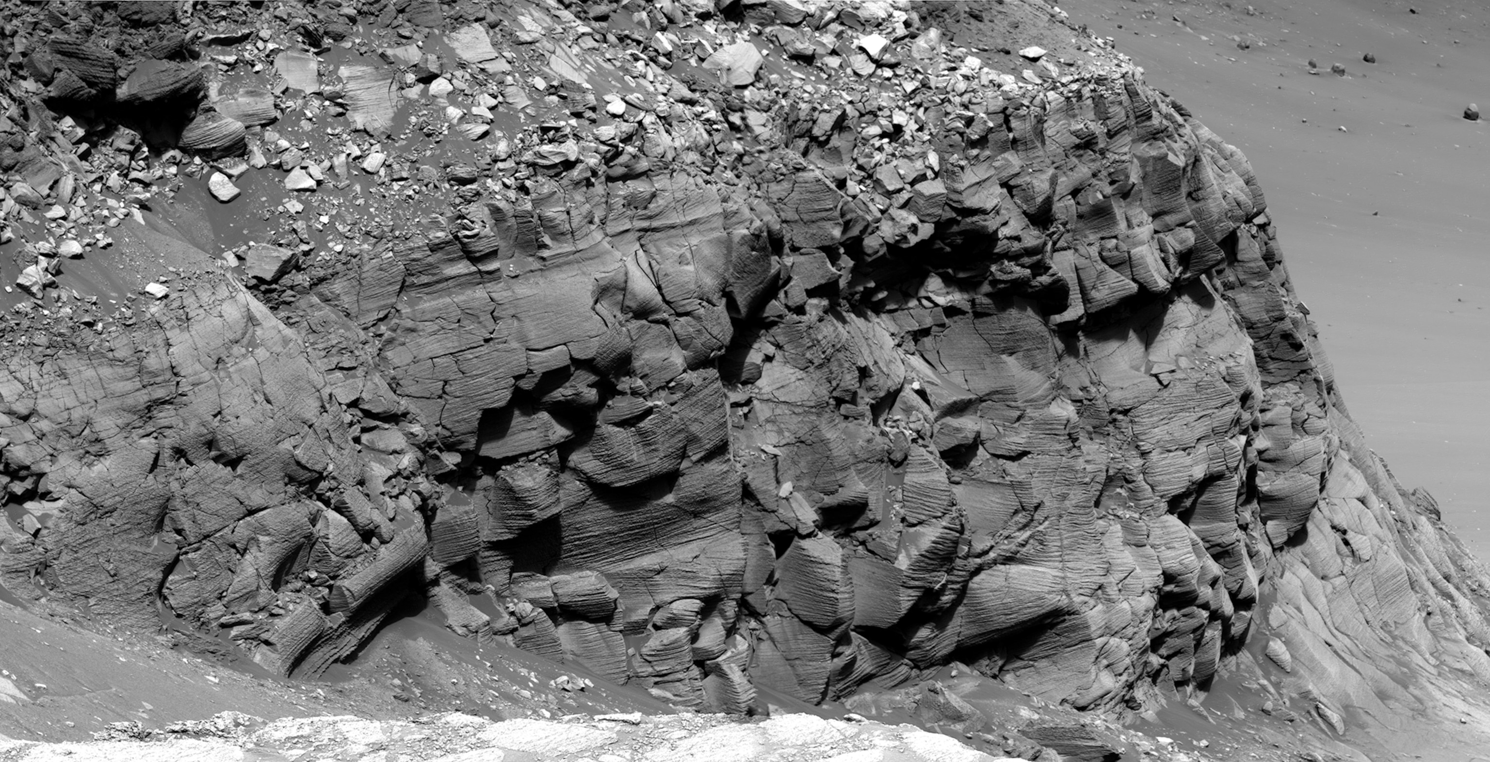 NASA's Mars Exploration Rover Opportunity captured this view of "Burns Cliff" after driving right to the base of this southeastern portion of the inner wall of "Endurance Crater." The view combines frames taken by Opportunity's panoramic camera between the rover's 287th and 294th martian days (Nov. 13 to 20, 2004).