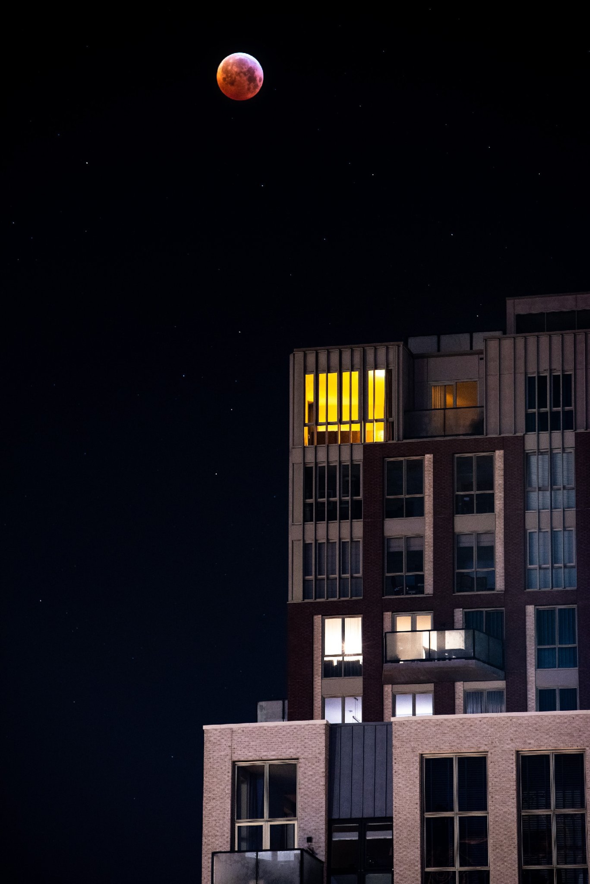 the blood moon over an apartment building.