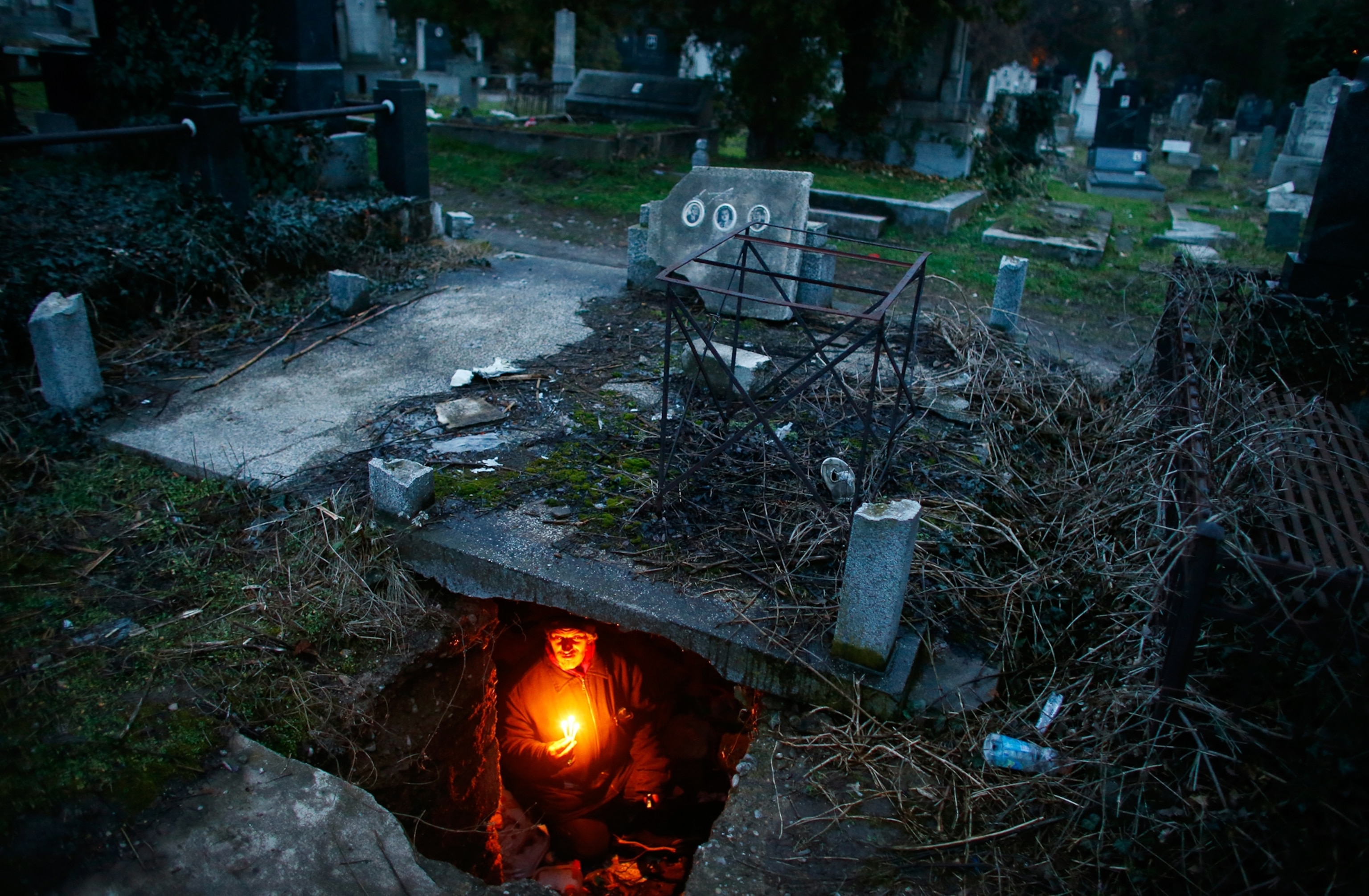 a homeless man in a cemetery in Nis, Serbia