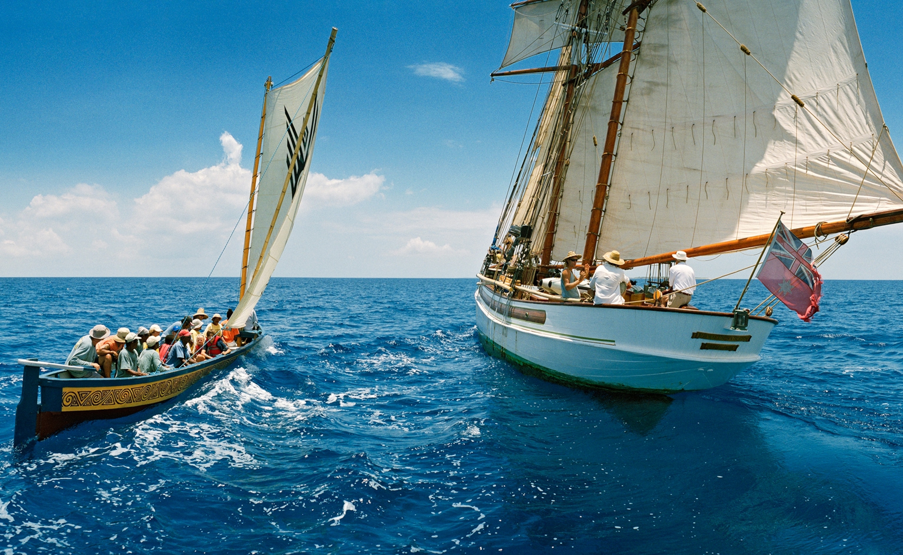 a 35-foot dugout canoe sailing from Anguilla to Tortola, British Virgin Islands, along with support ship, 90 foot top sail schooner Fiddlers Green, right before changing crew
