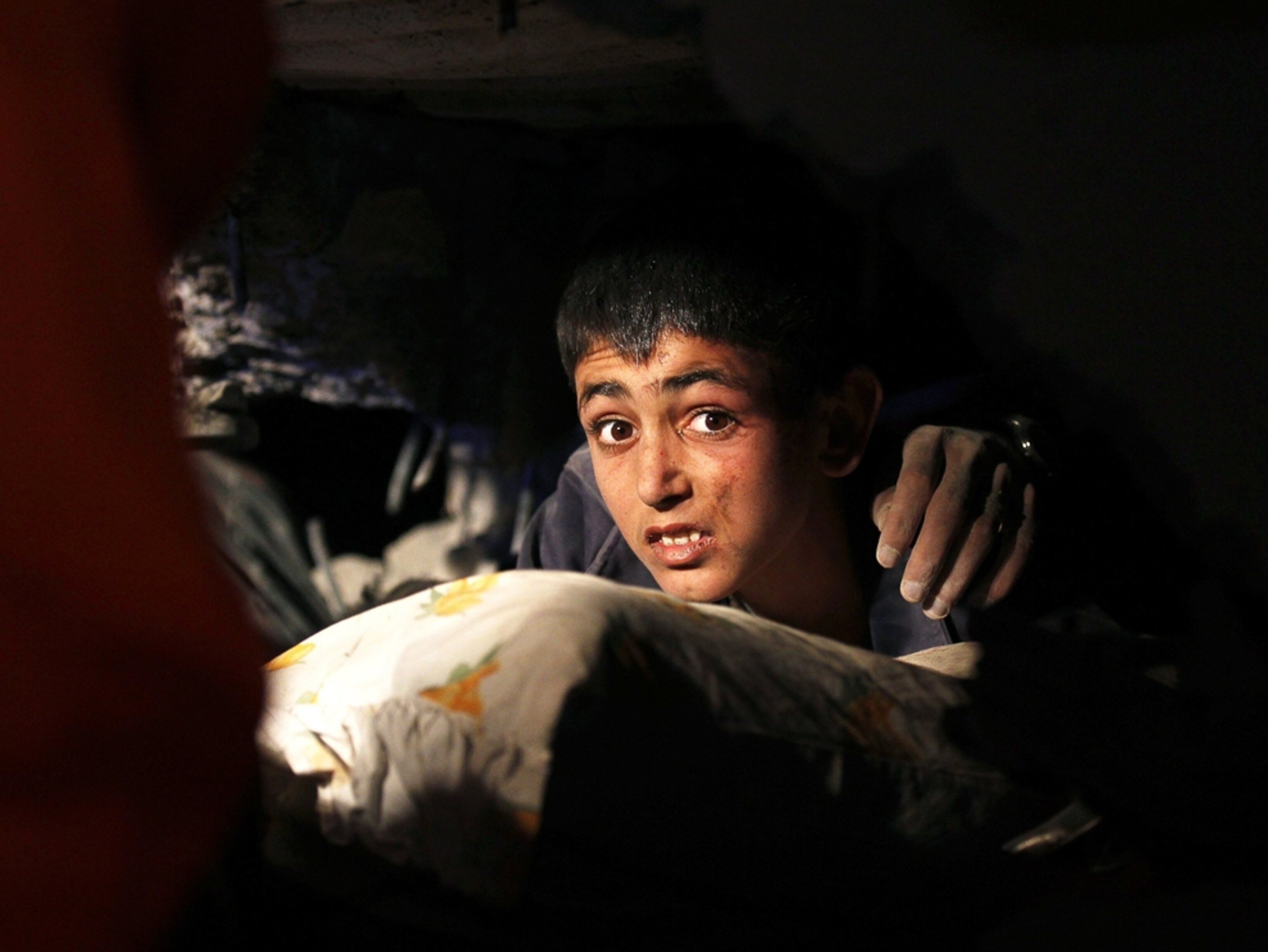 Turkey earthquake picture: A young boy trapped under debris waiting to be rescued