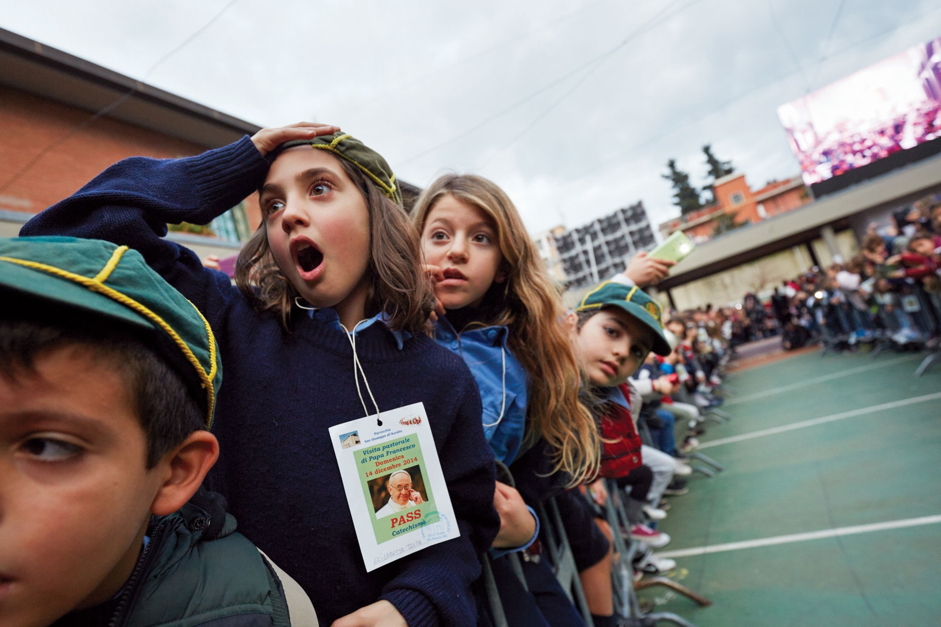 a girl waiting to see Pope Francis in St. Peter's Square