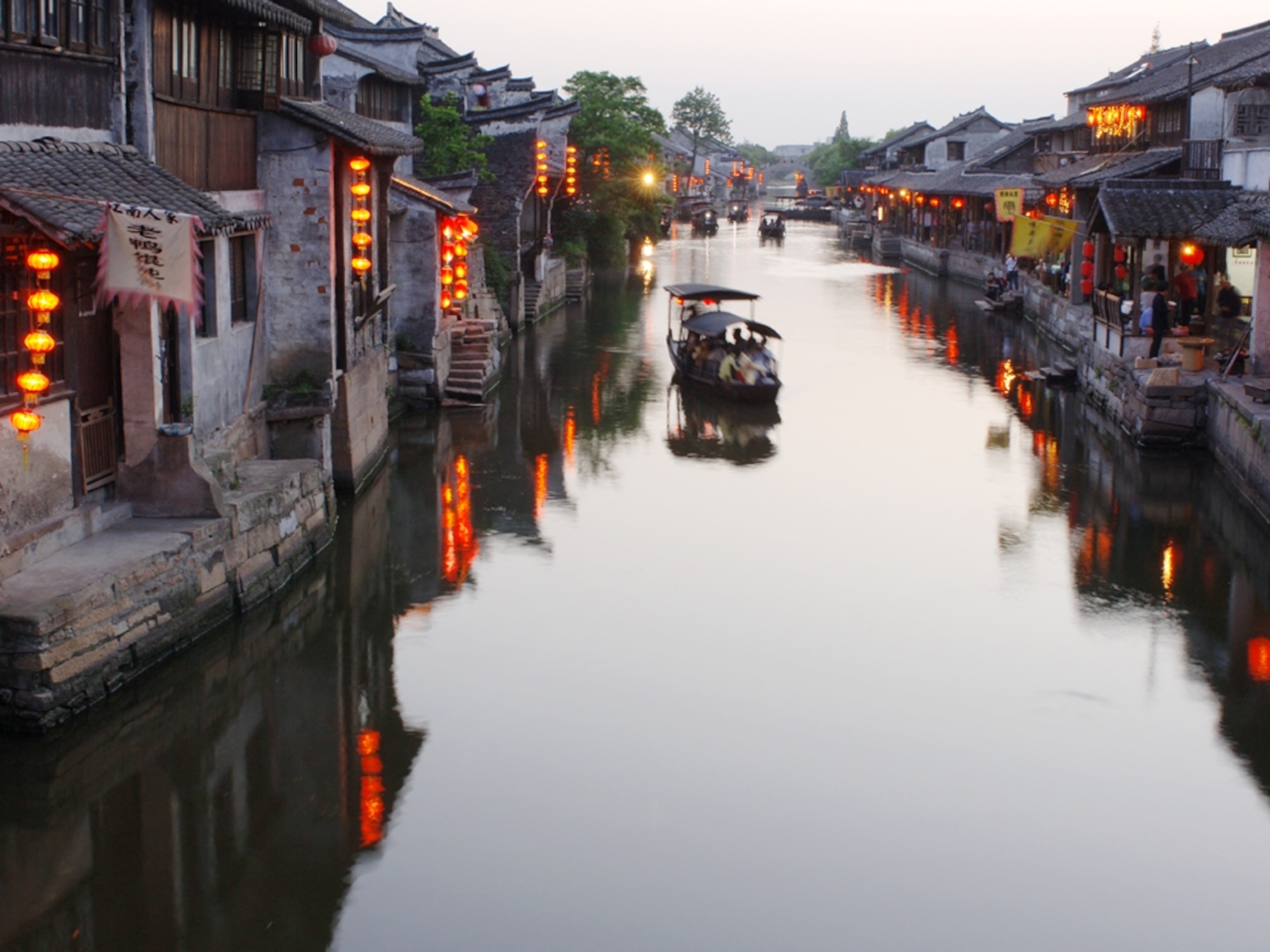 Boat on water thoroughfare, Xitang, Zhejiang, China