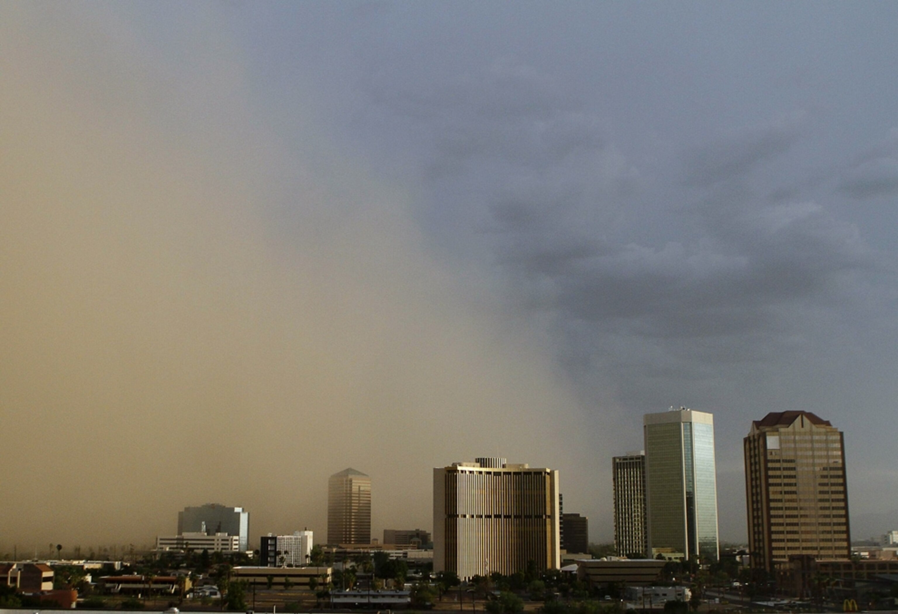 a dust storm moving over highrise buildings in Arizona