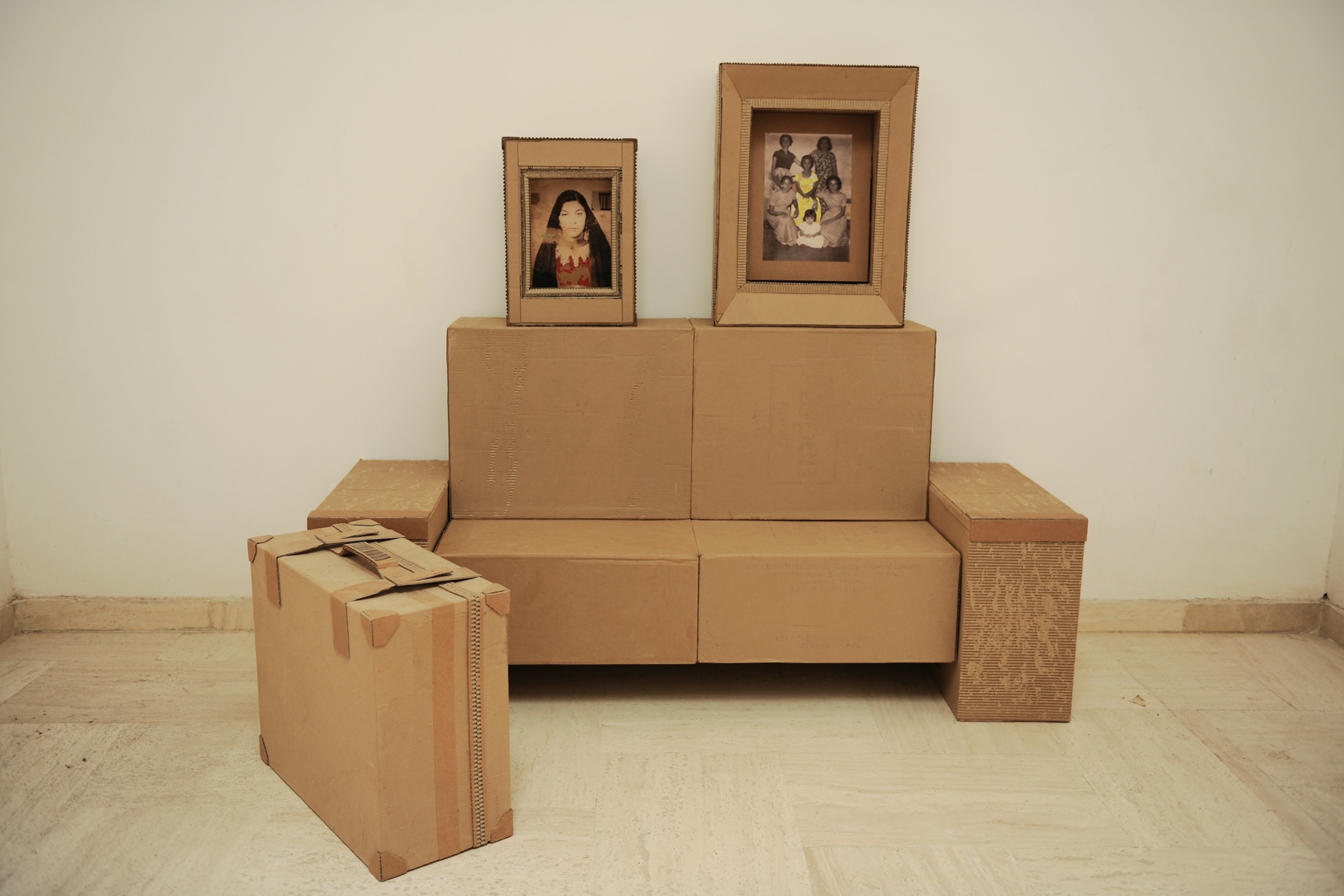 Art of Iraq - Cardboard boxes arranged as furniture.