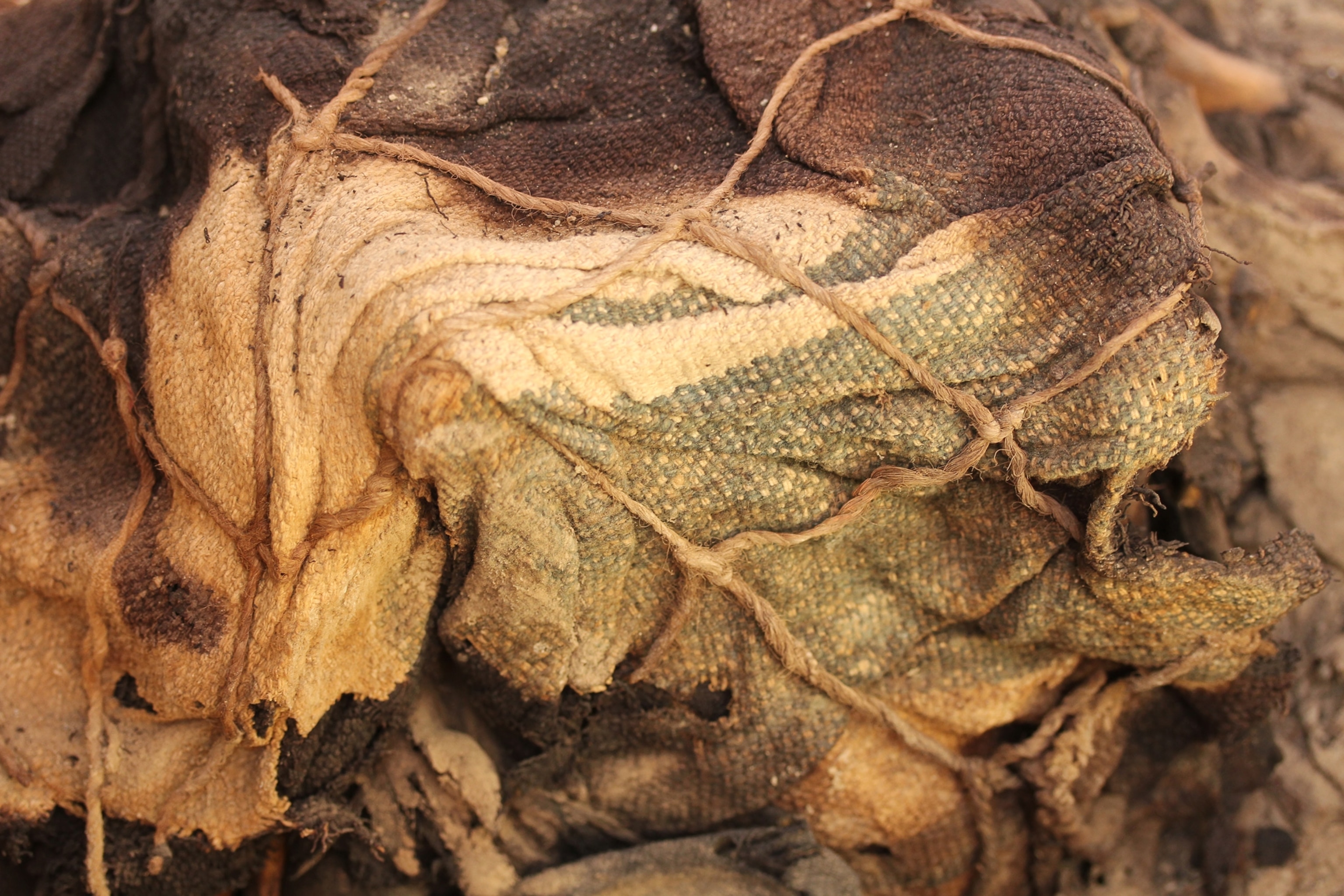 Peru Tomb - A bundle of cloth containing a human skeleton.
