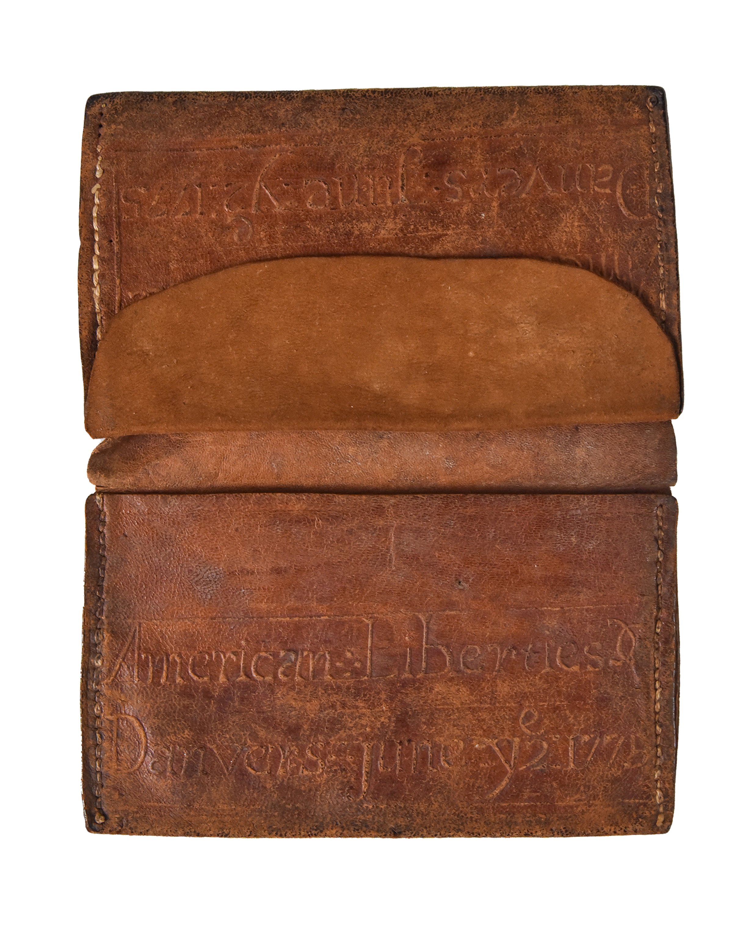 The wallet of Ezekiel Bouker who served as a private in Capt. John Wheeler's company, which marched on the alarm of April 19, and with American forces besiegeing British-occupied Boston, embossed with the cause for which he fought: “American Liberties, Danvers, June ye 2, 1775.”