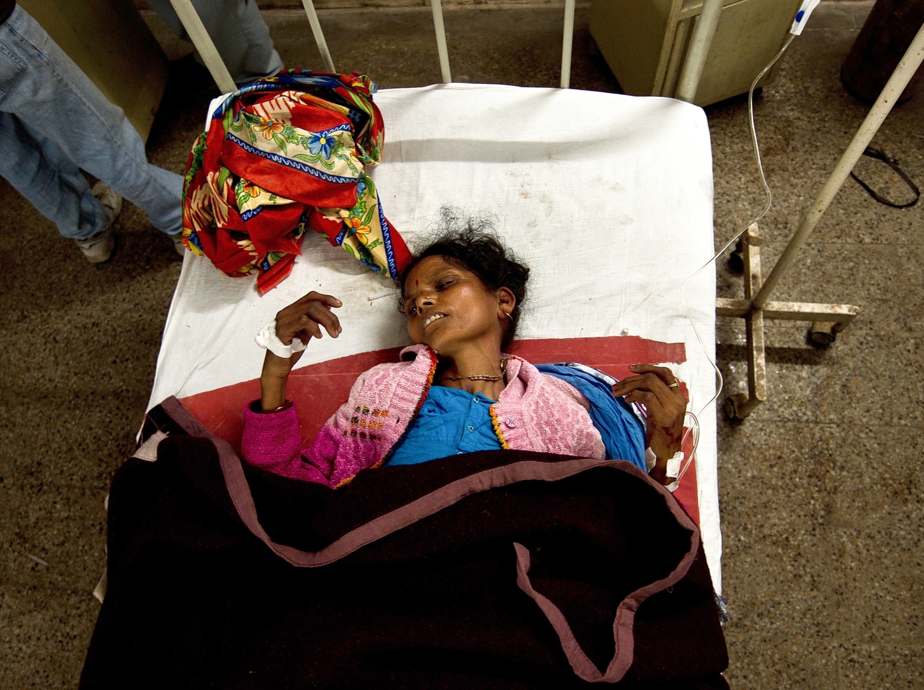 a stampede victim in a hospital bed, Kumbh Mela festival, Allahabad