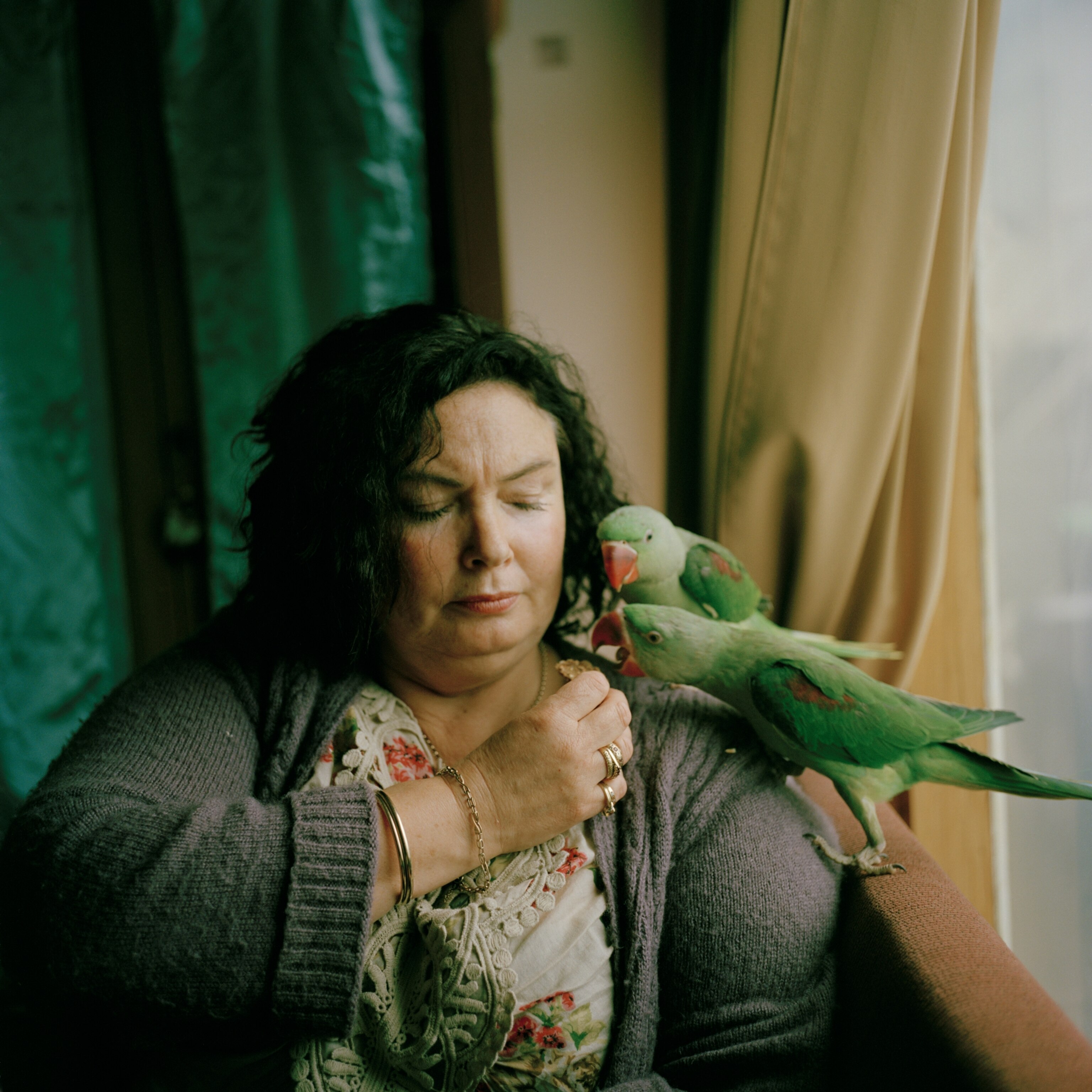 woman with parrots