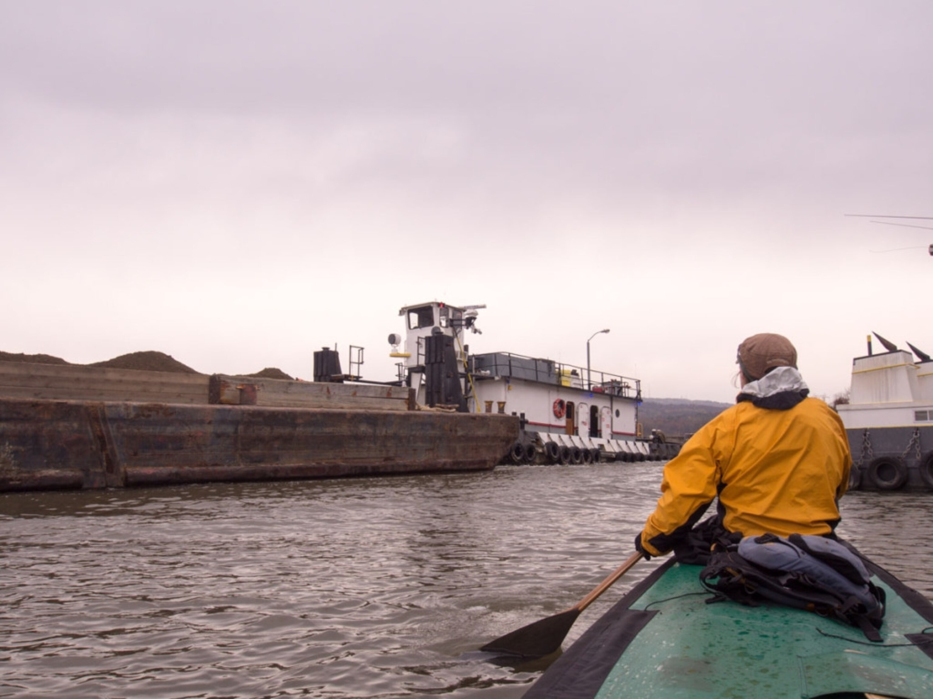 The Freemans dodge barges full of PCB contaminated sediments along the Hudson River north of Albany, New York. Photo by Dave Freeman @FreemanExplore