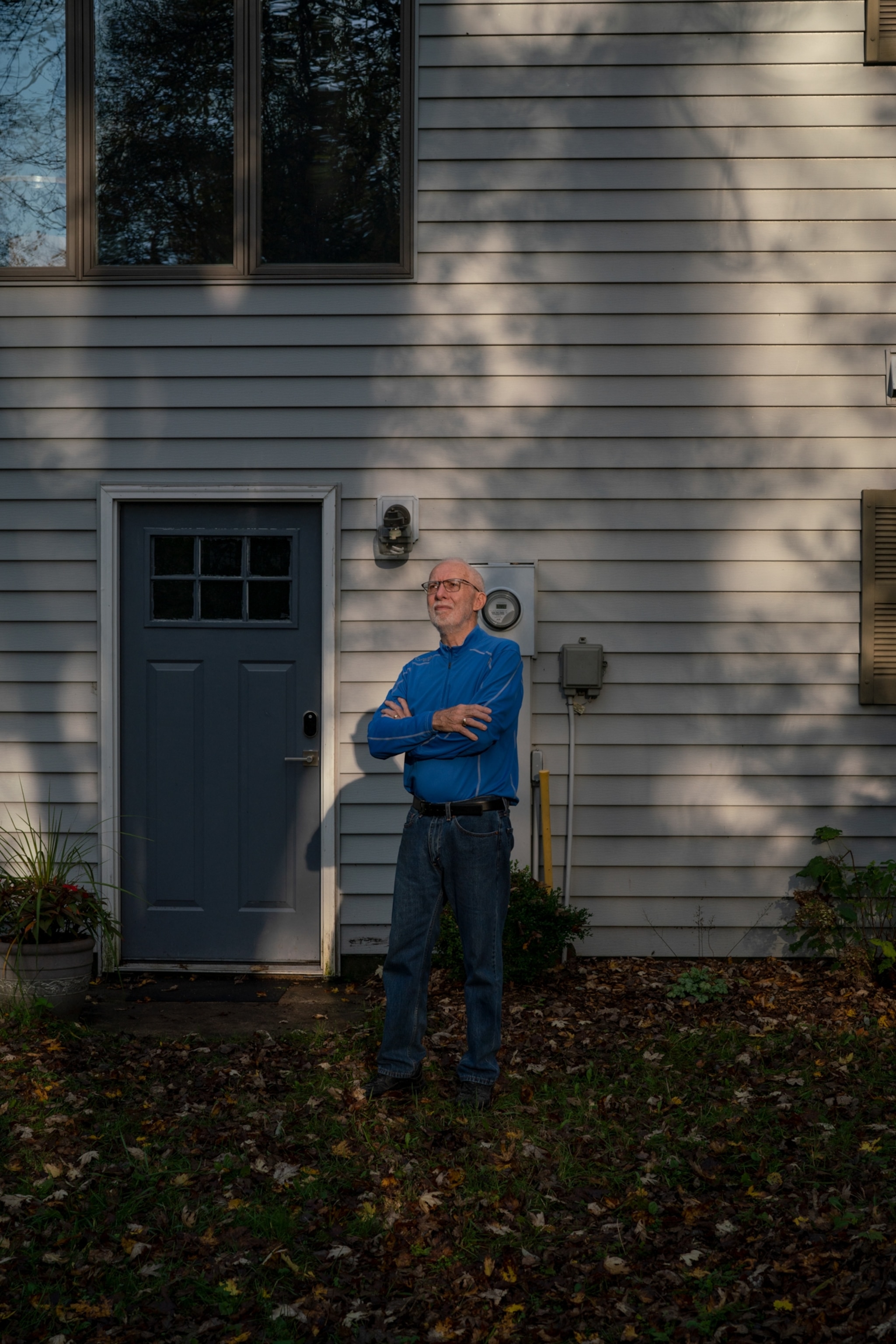 a man stands in his front yard in Michigan