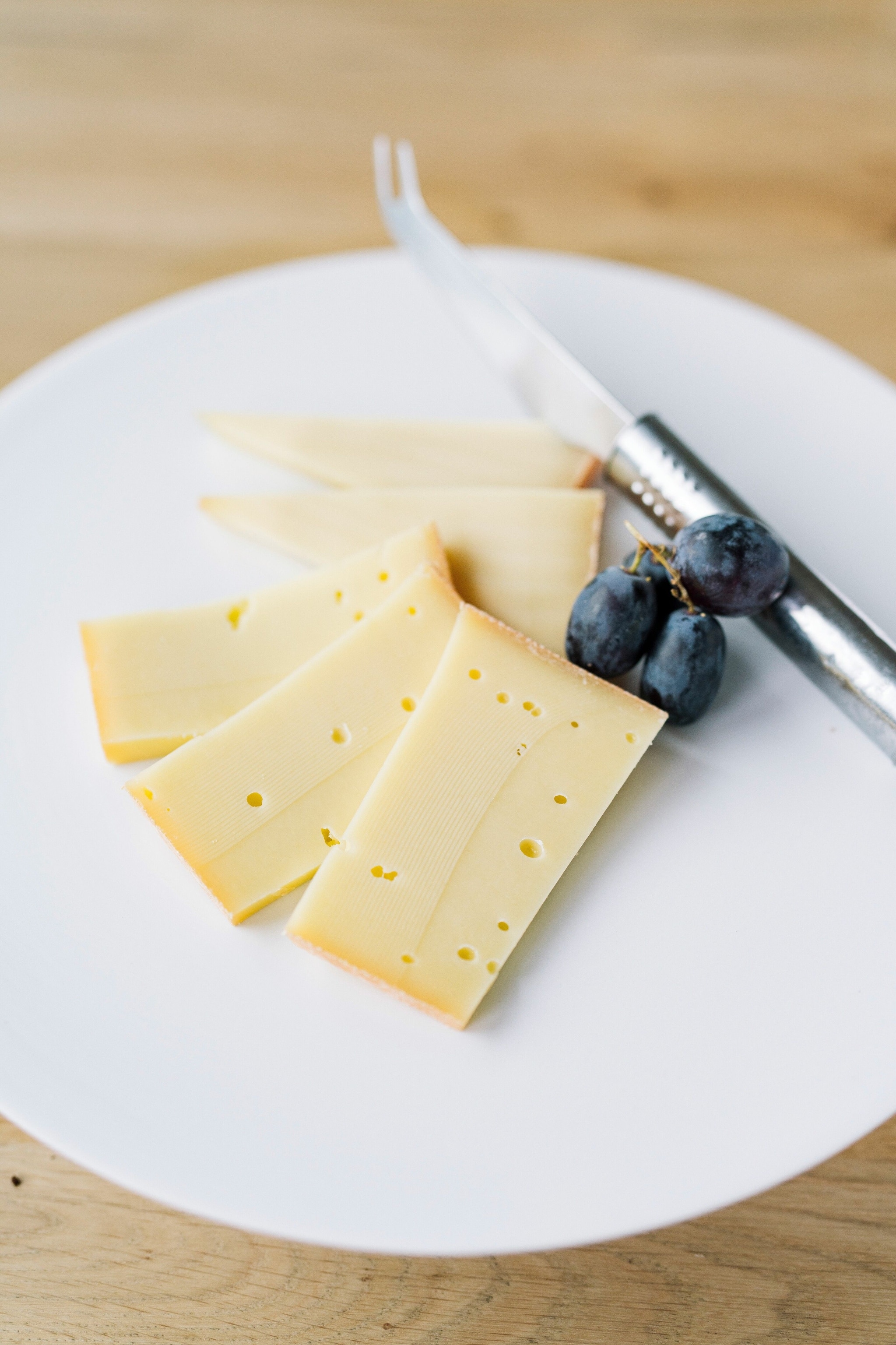 Slices of hard cheese on a plate