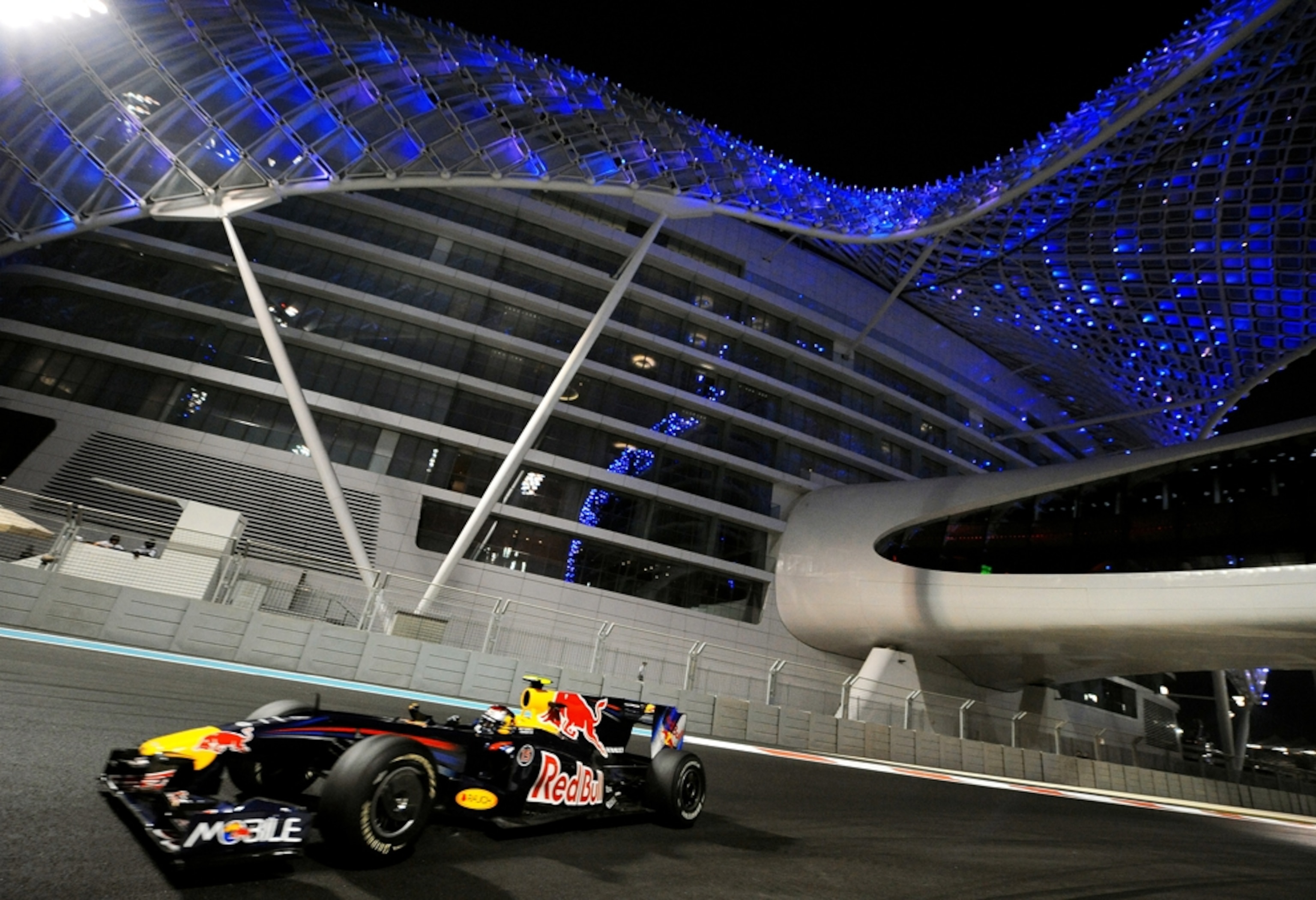 Race car in front of modern building
