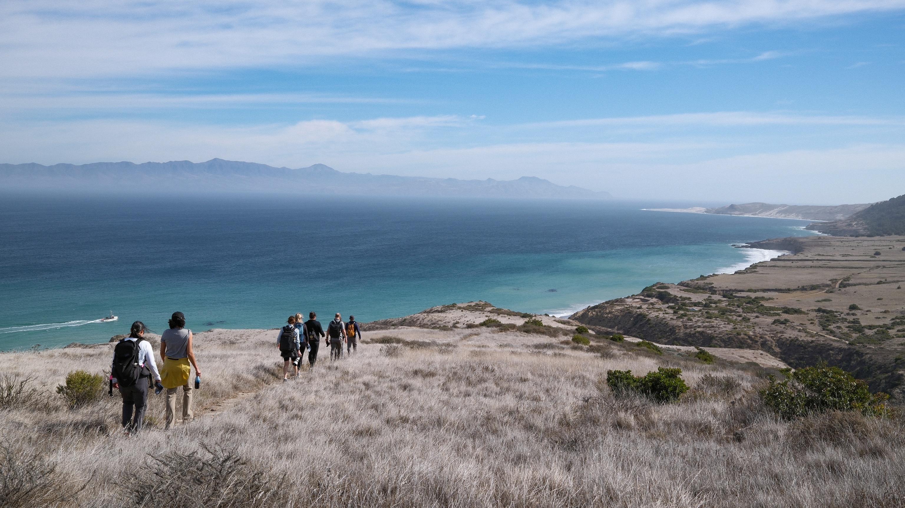 Attendees of the Perpetual Planet Ocean Expeditions Convening hiking through Santa Rosa Island. The National Geographic Society convened National Geographic Explorers selected for the Perpetual Planet Ocean Expeditions, together with the Society and Disney staff in the Channel Islands National Park over five days aboard the Lindblad Expeditions vessel, National Geographic Sea Lion.