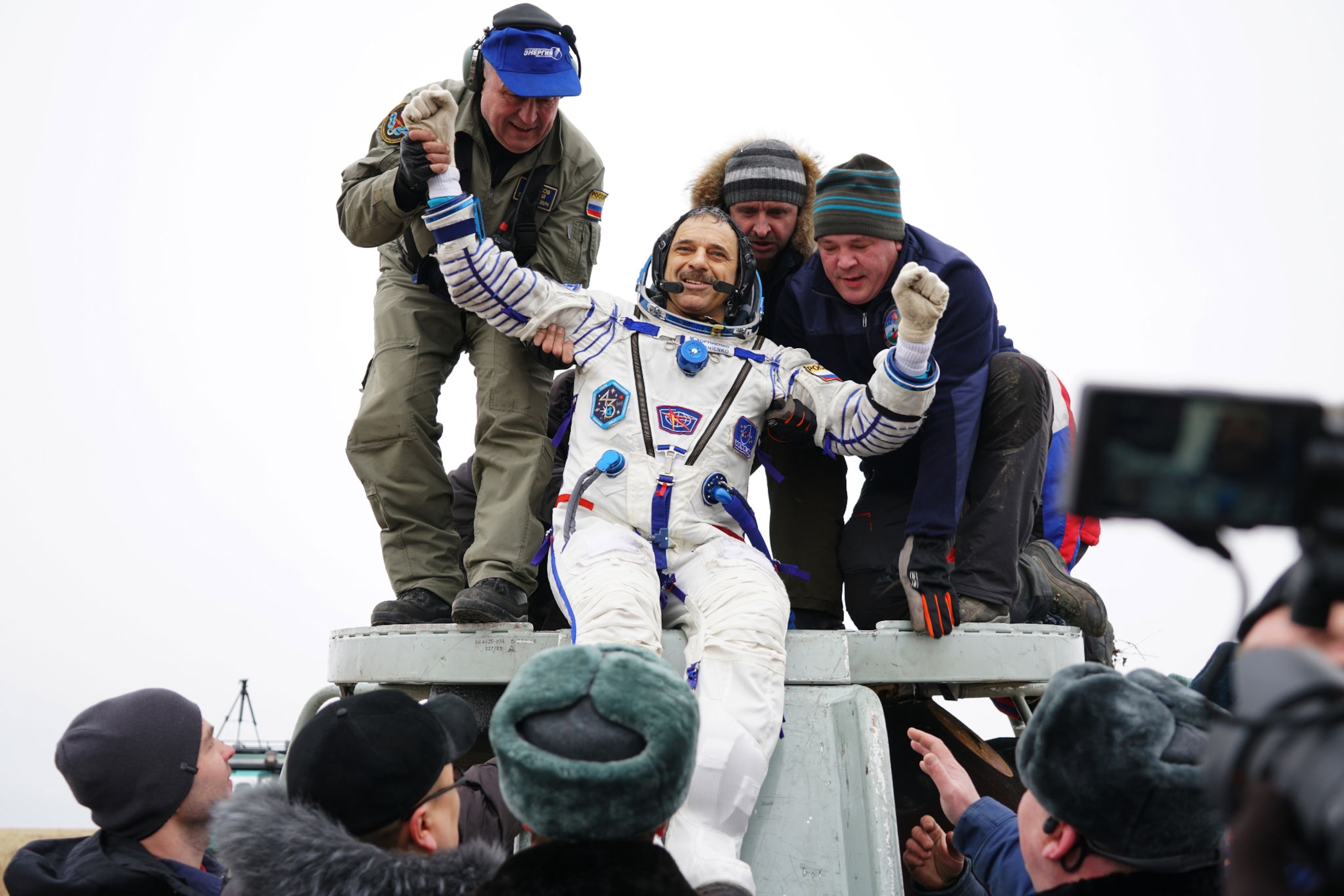man coming out of capsule