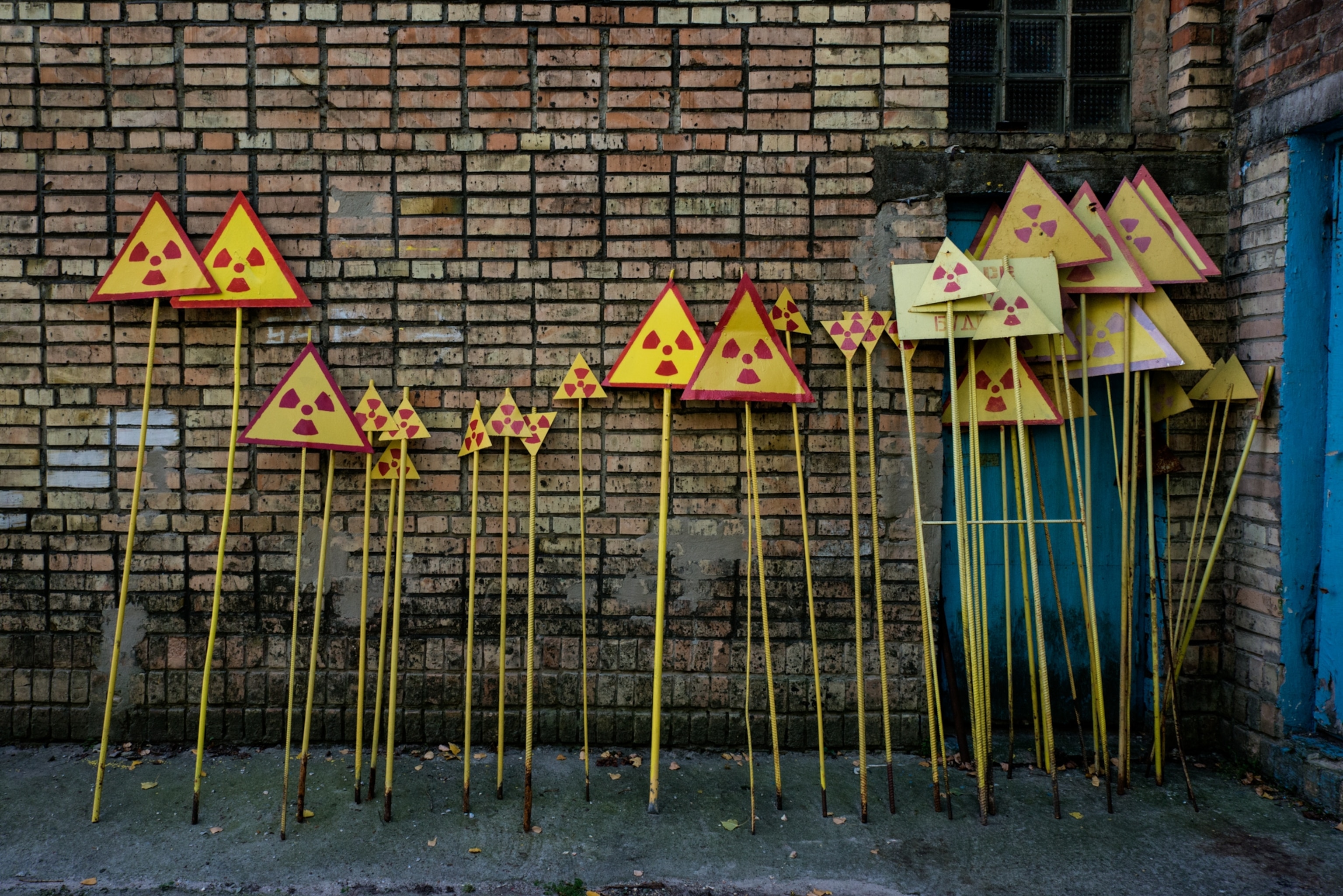 Fresh painted warning signs ready for the distribution inside the Chernobyl exclusion zone