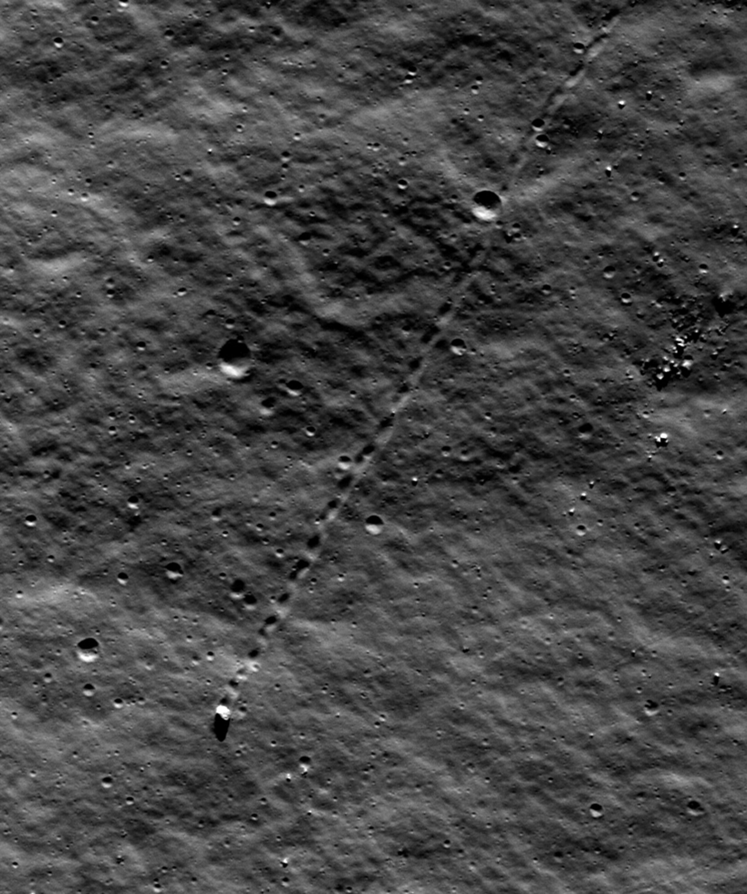Moon picture: tracks of a boulder that rolled down a slope