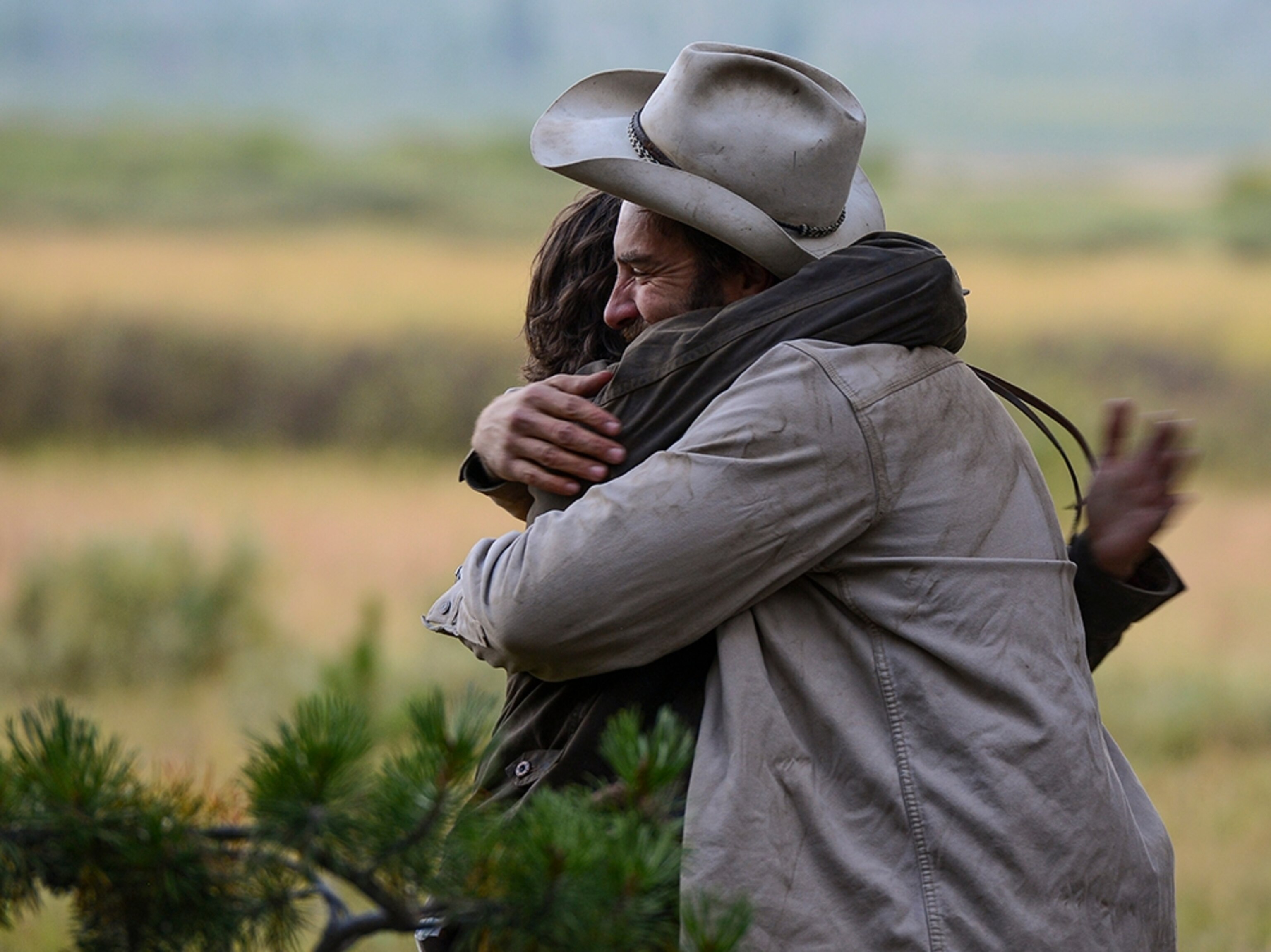 Ray Knell hugging friend Micah Fink.