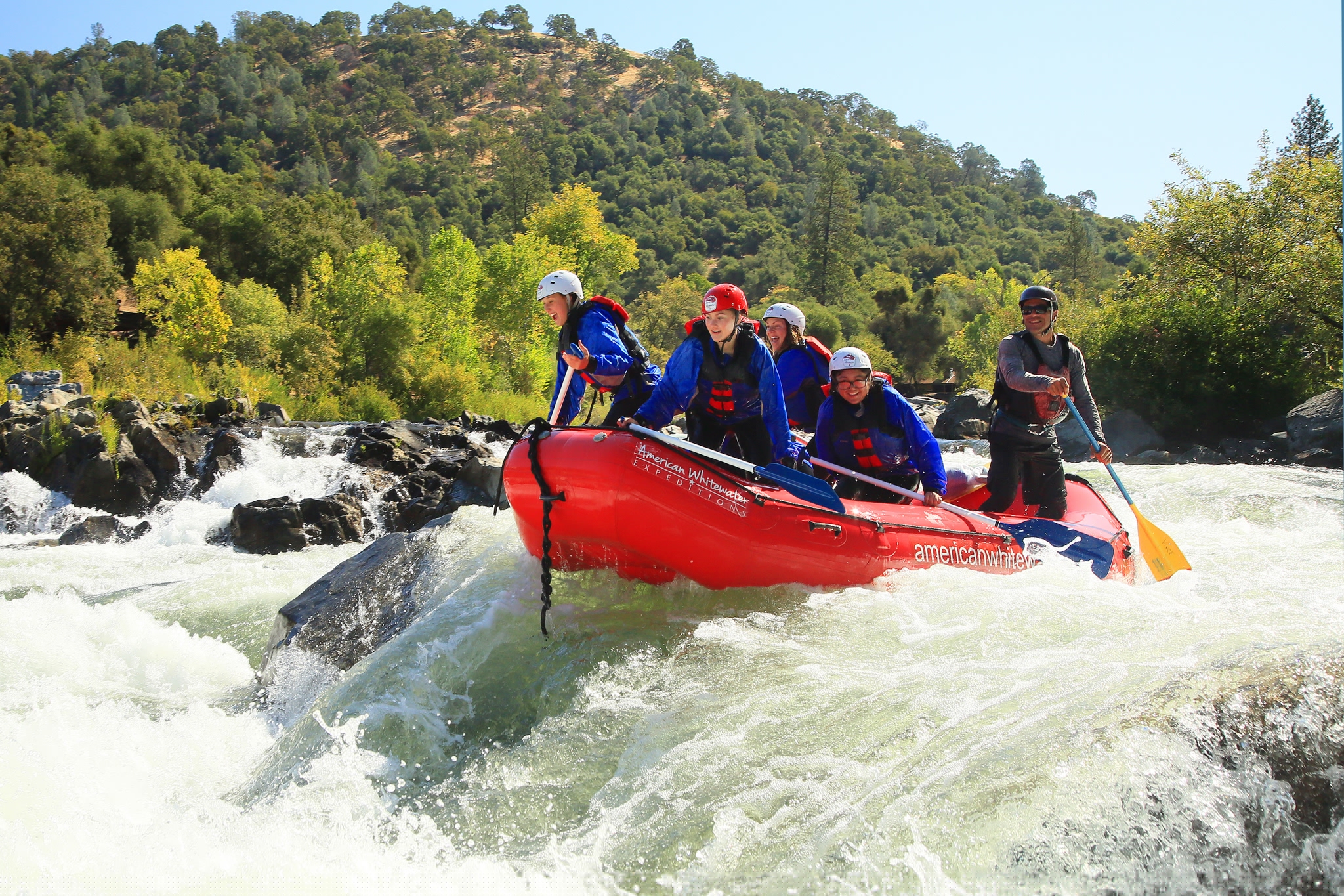 Rafters manouvering through rapids on the South Fork of the American River.