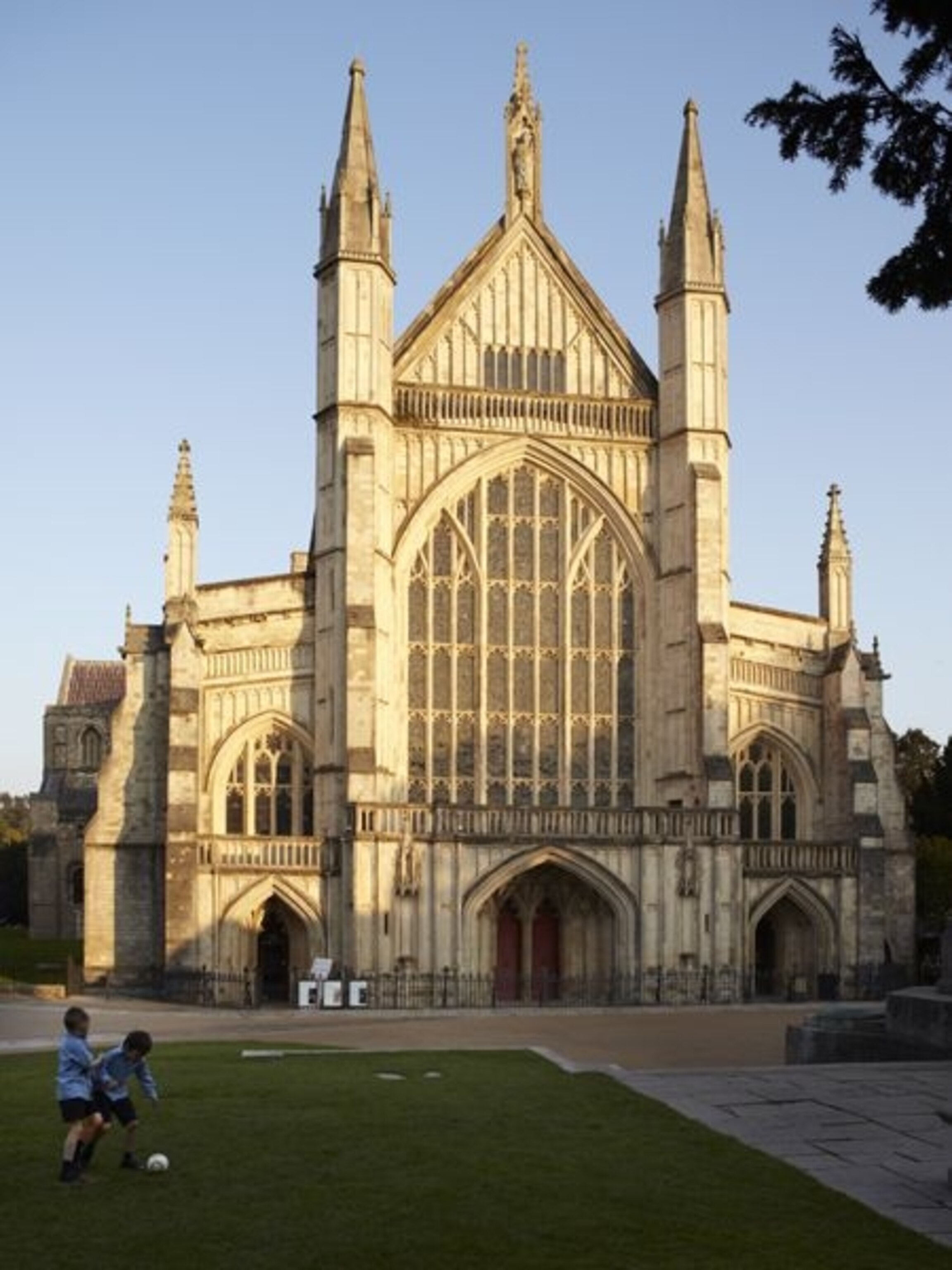 boys playing soccer by Winchester Cathedral