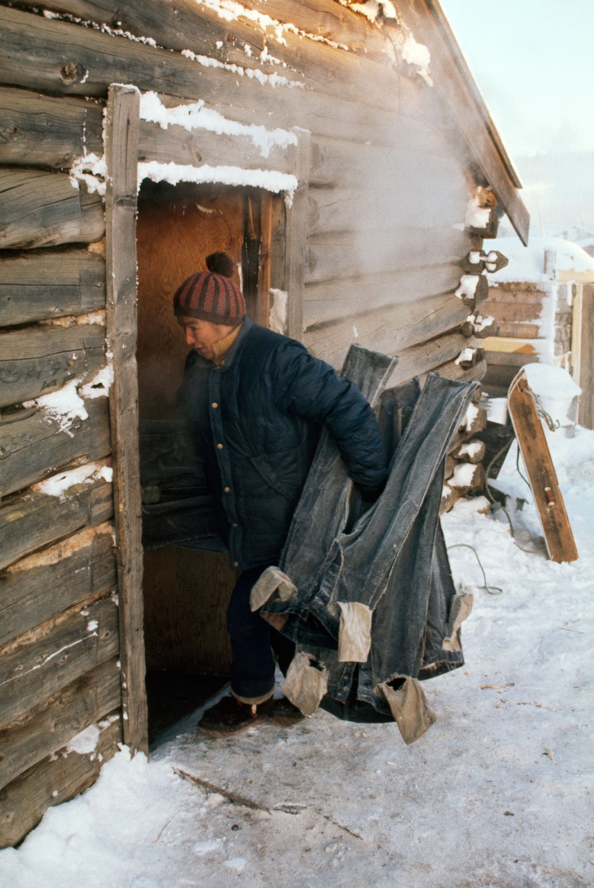 woman in alaska with frozen pants