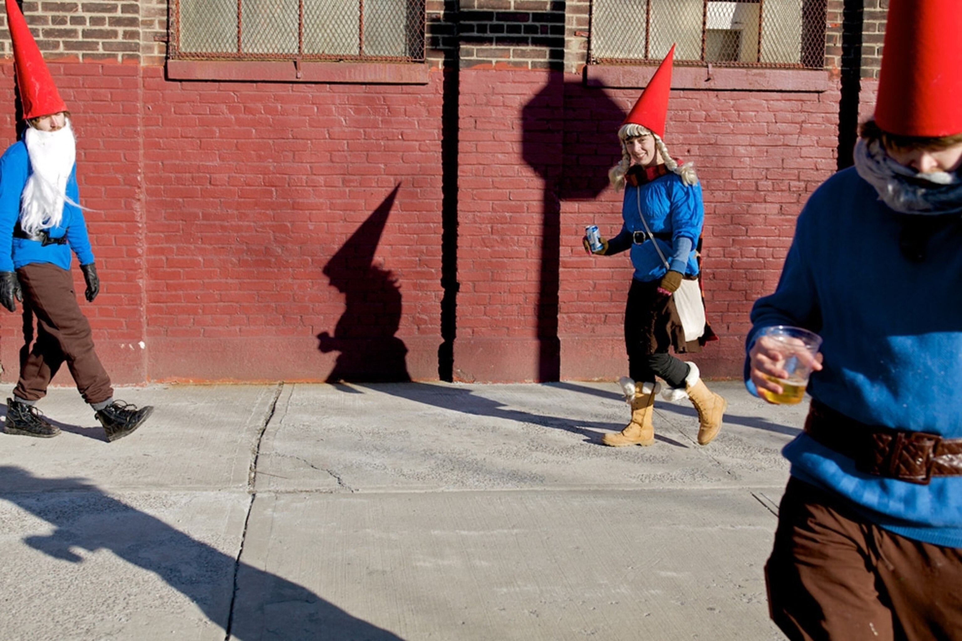 Three people dressed as gnomes