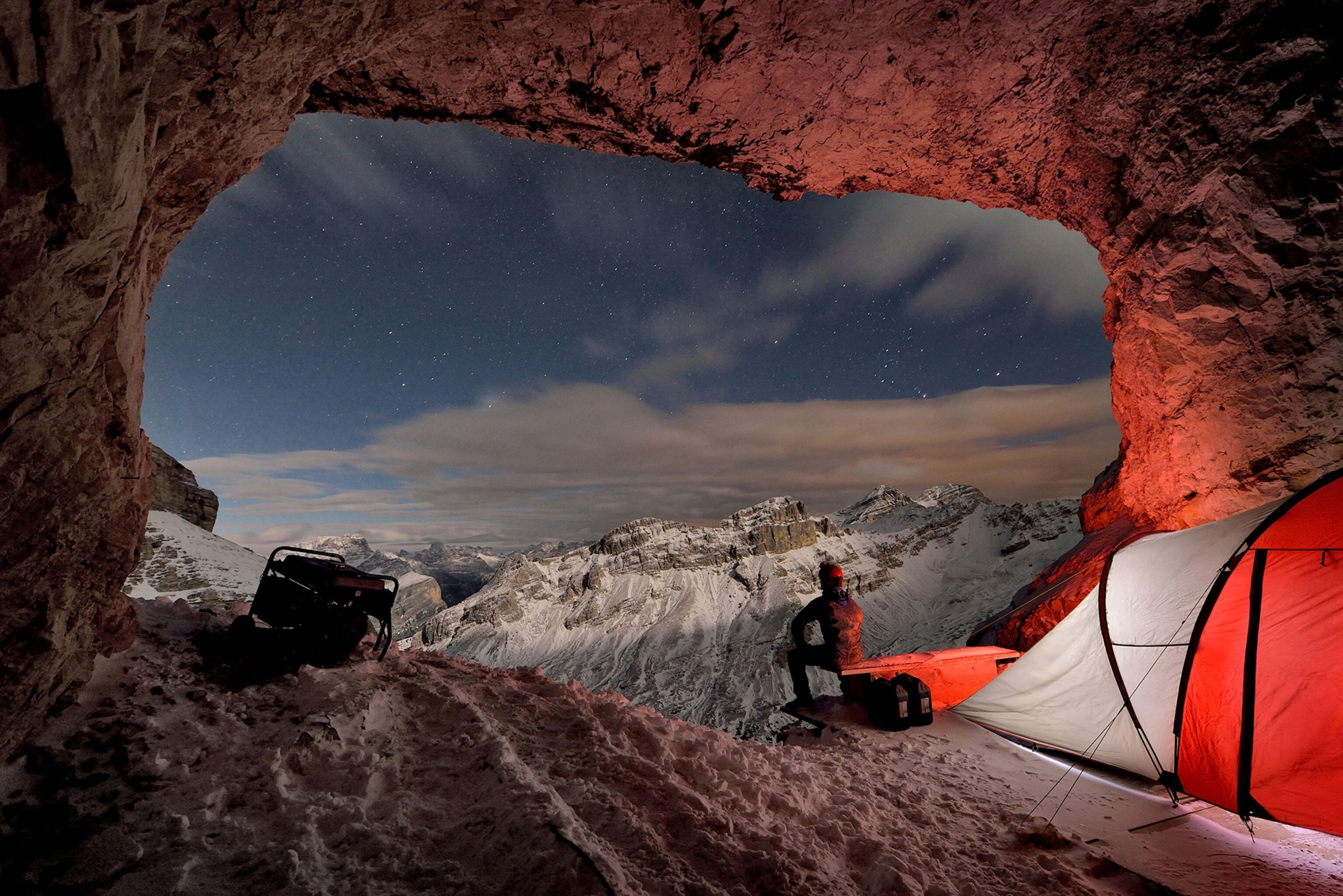 a person sitting in a cave