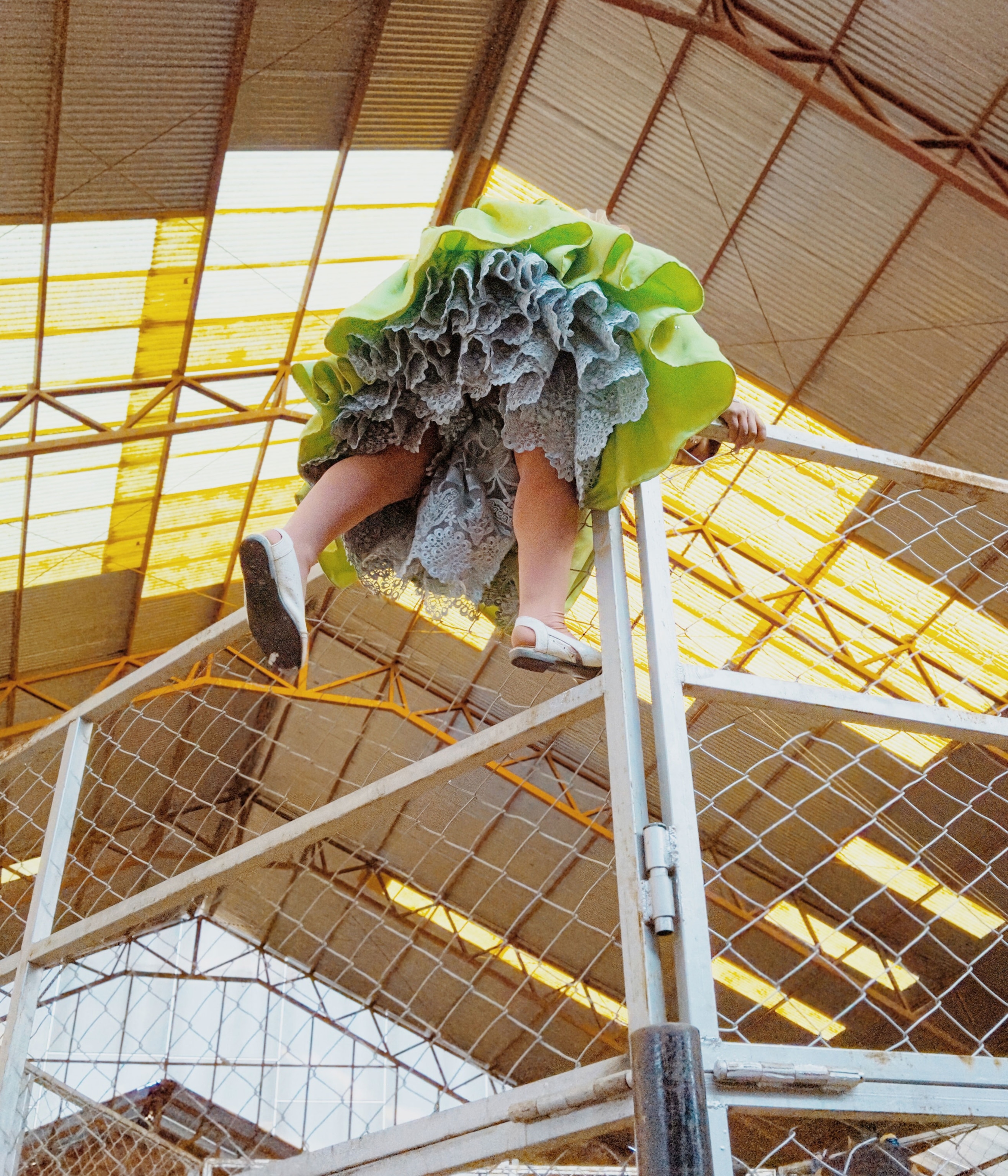 an indigenous woman entering a wrestling ring in Bolivia
