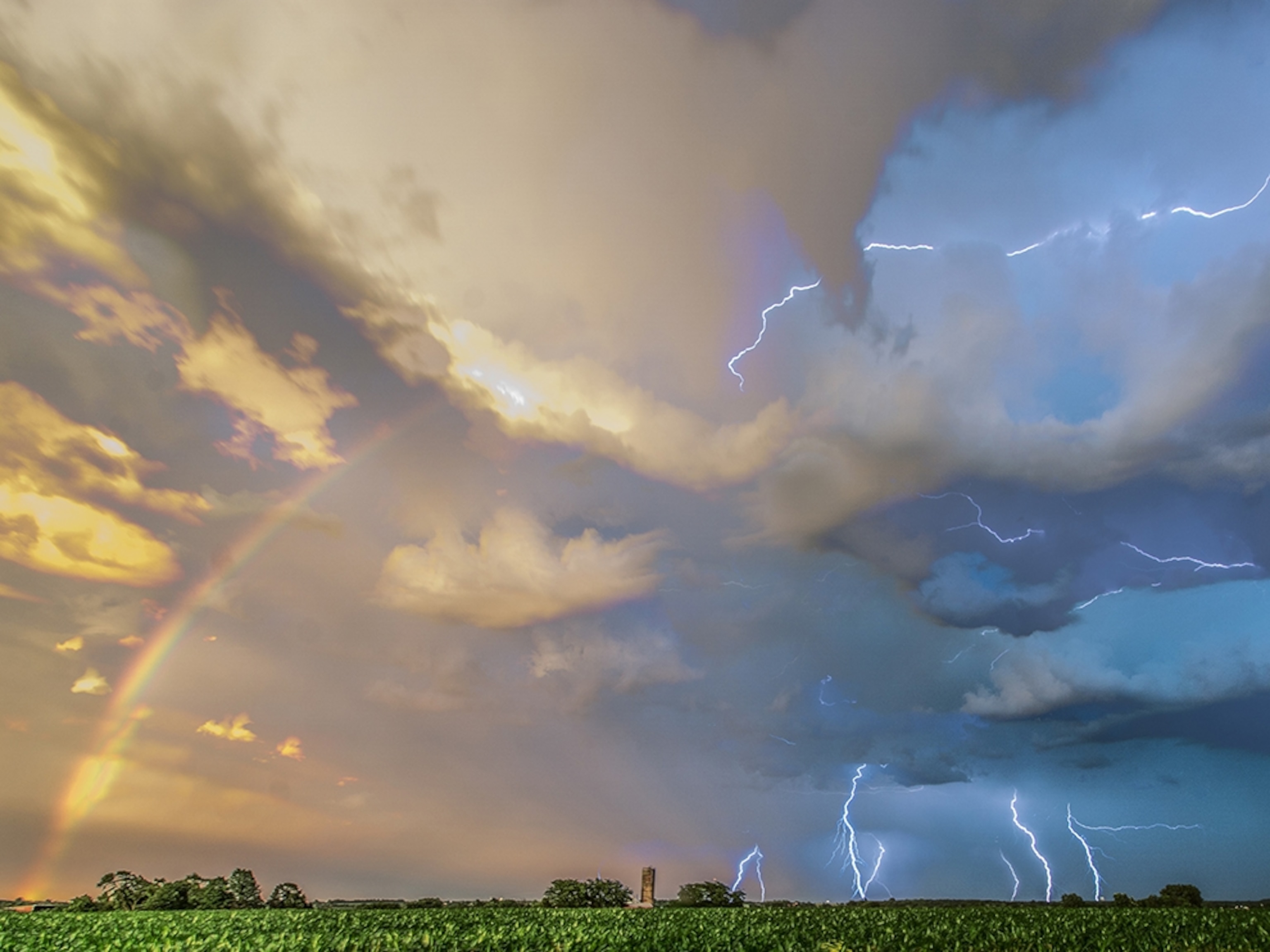 lightning and a rainbow during a storm in Iowa