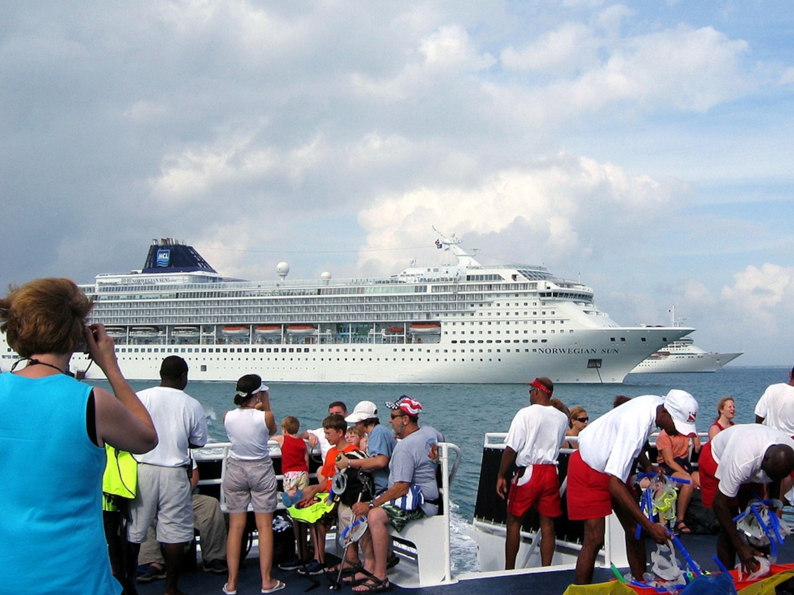 Tourists leave their cruise ship in Belize
