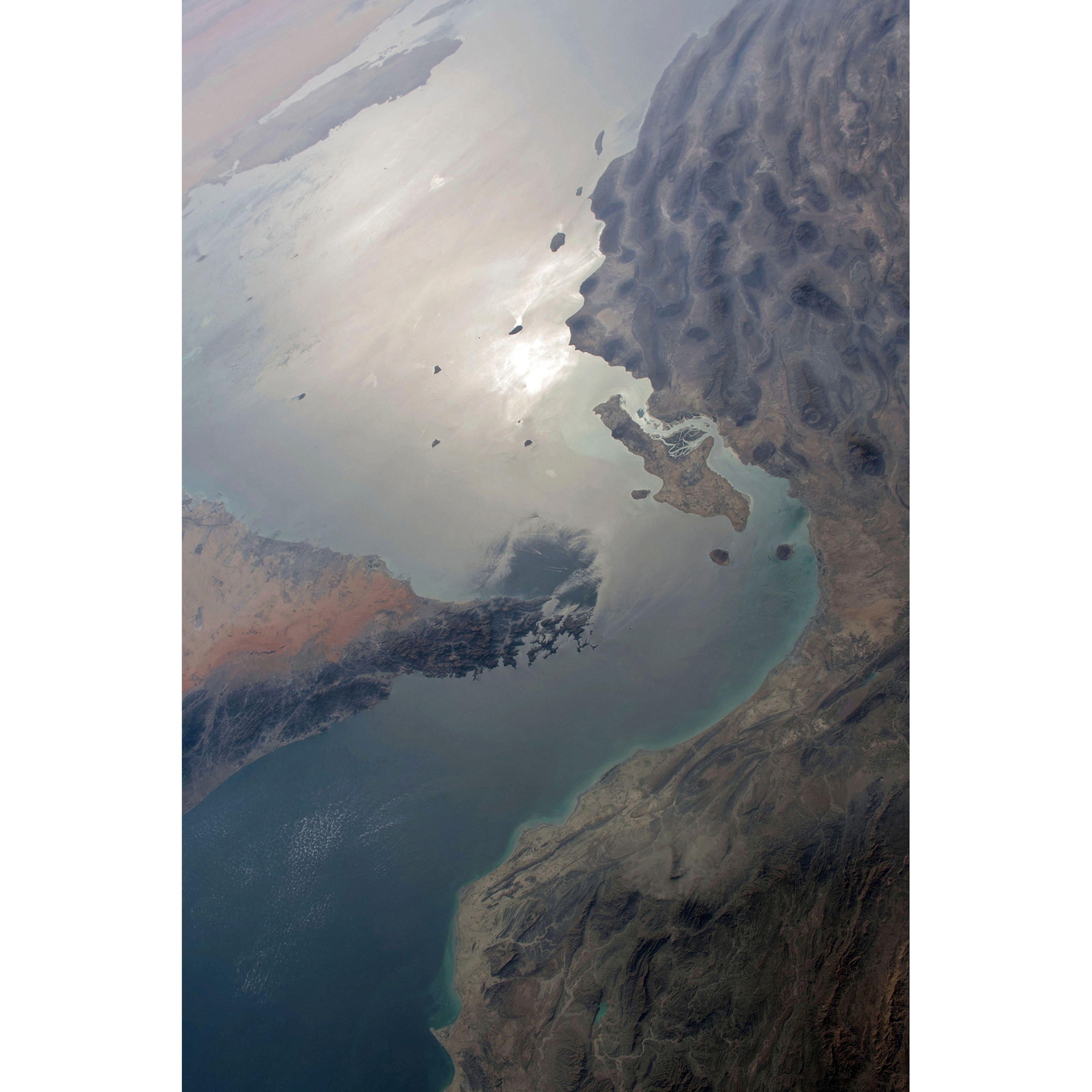 STRAIT OF HORMUZ, HARF GHABI, BAY, OMAN. Photograph taken from the International Space Station on 24 March 2021 An optimised version of an original NASA image: Credit NASA