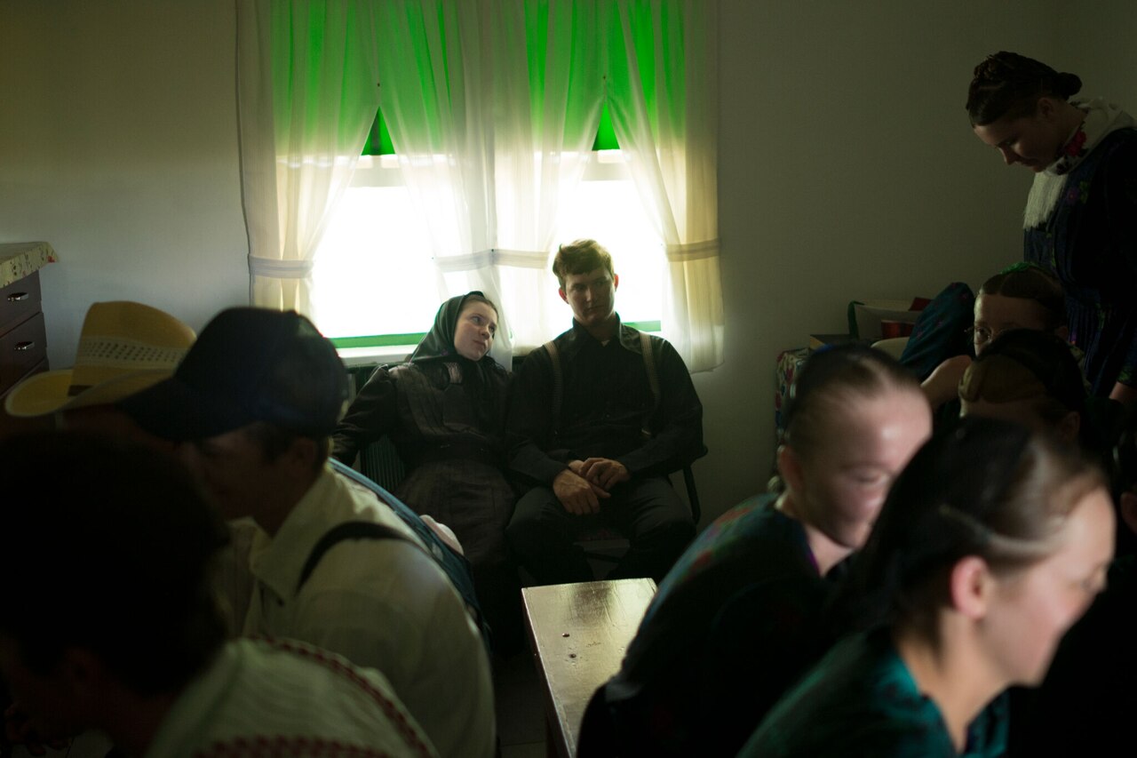 Bride Sarah Suderman, 21, looks at her groom Abraham Henz, 23, during a break in their wedding ceremony. Colonia Oriente, Bolivia. 2013