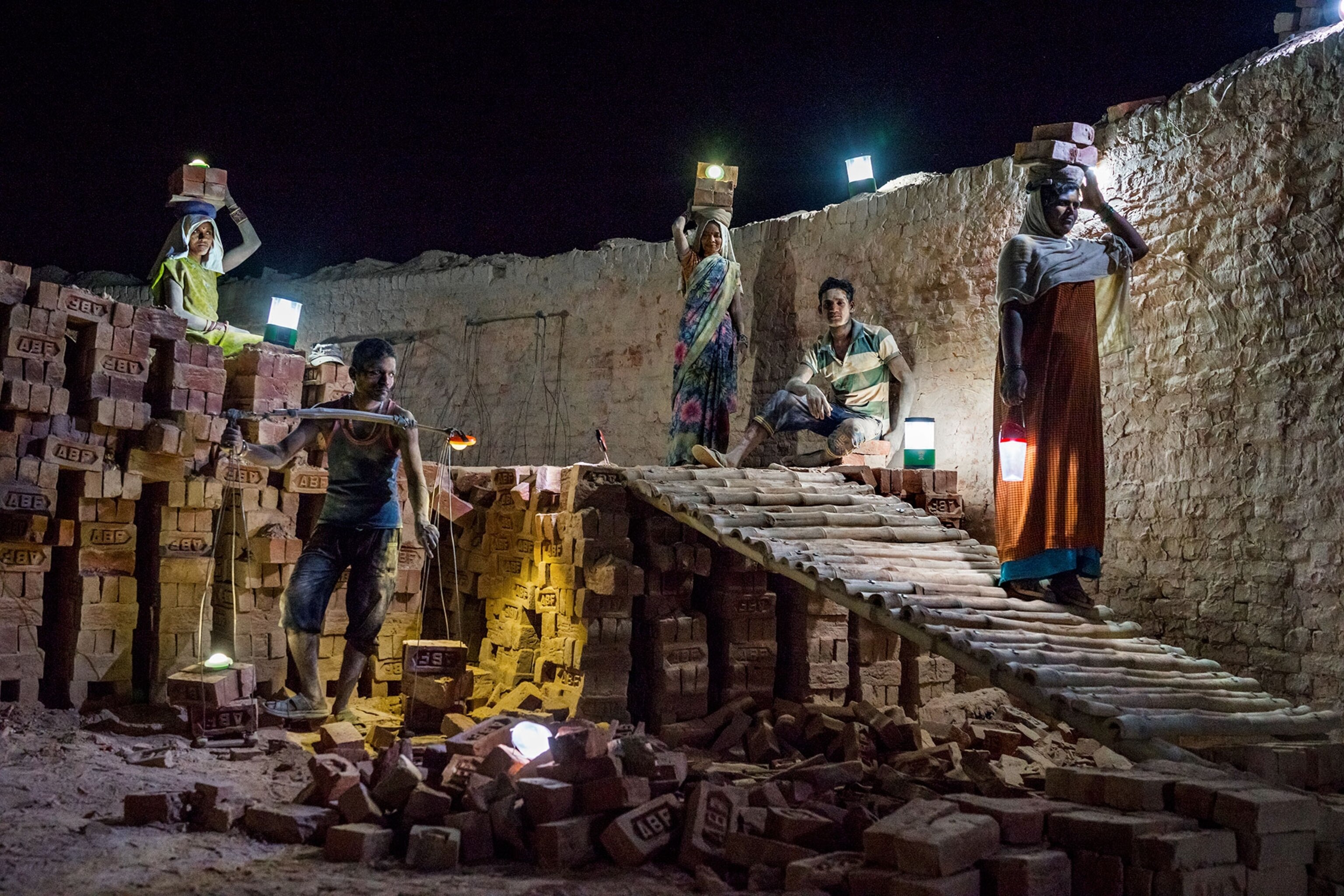 people in India using solar lamps