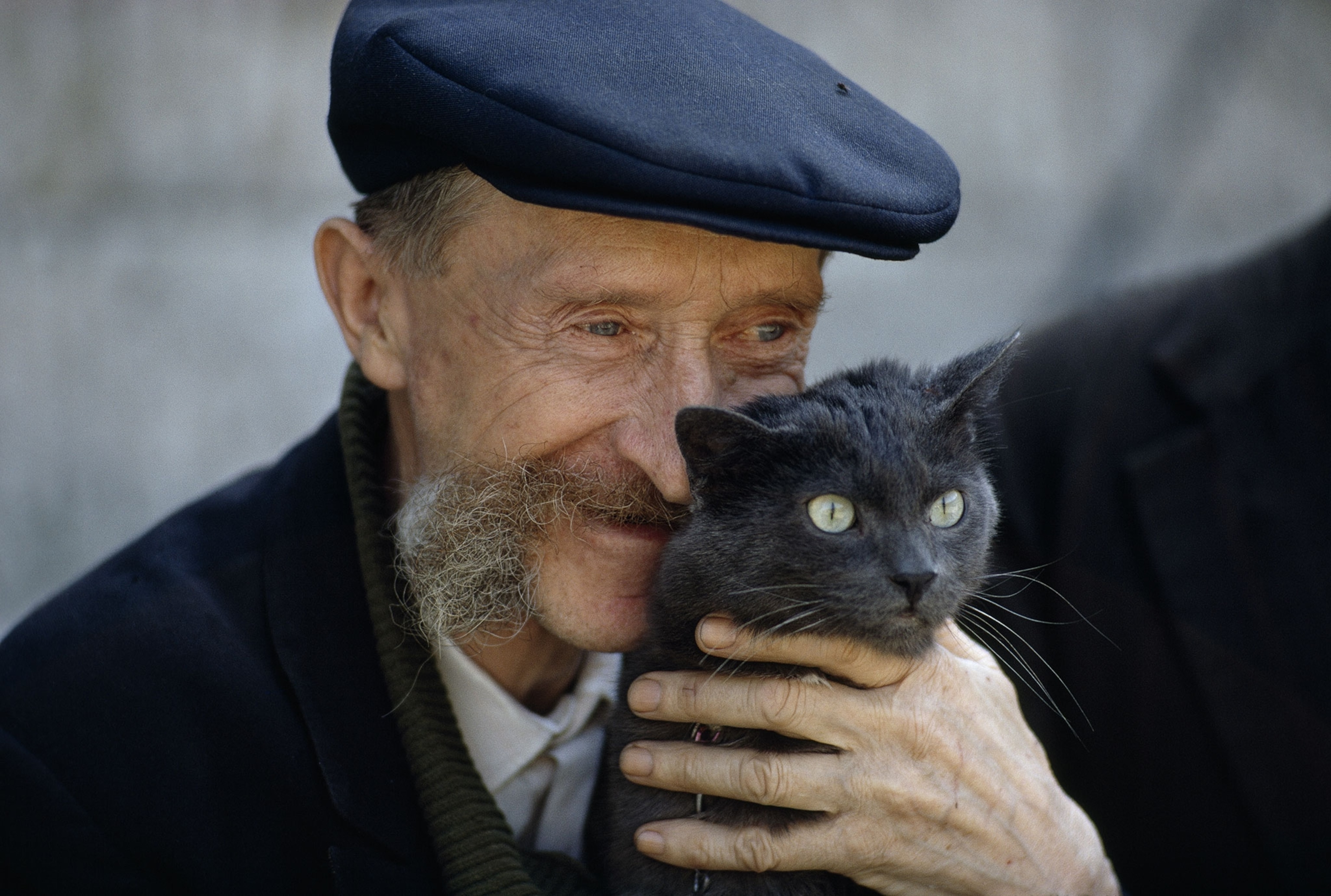 a man holding a cat