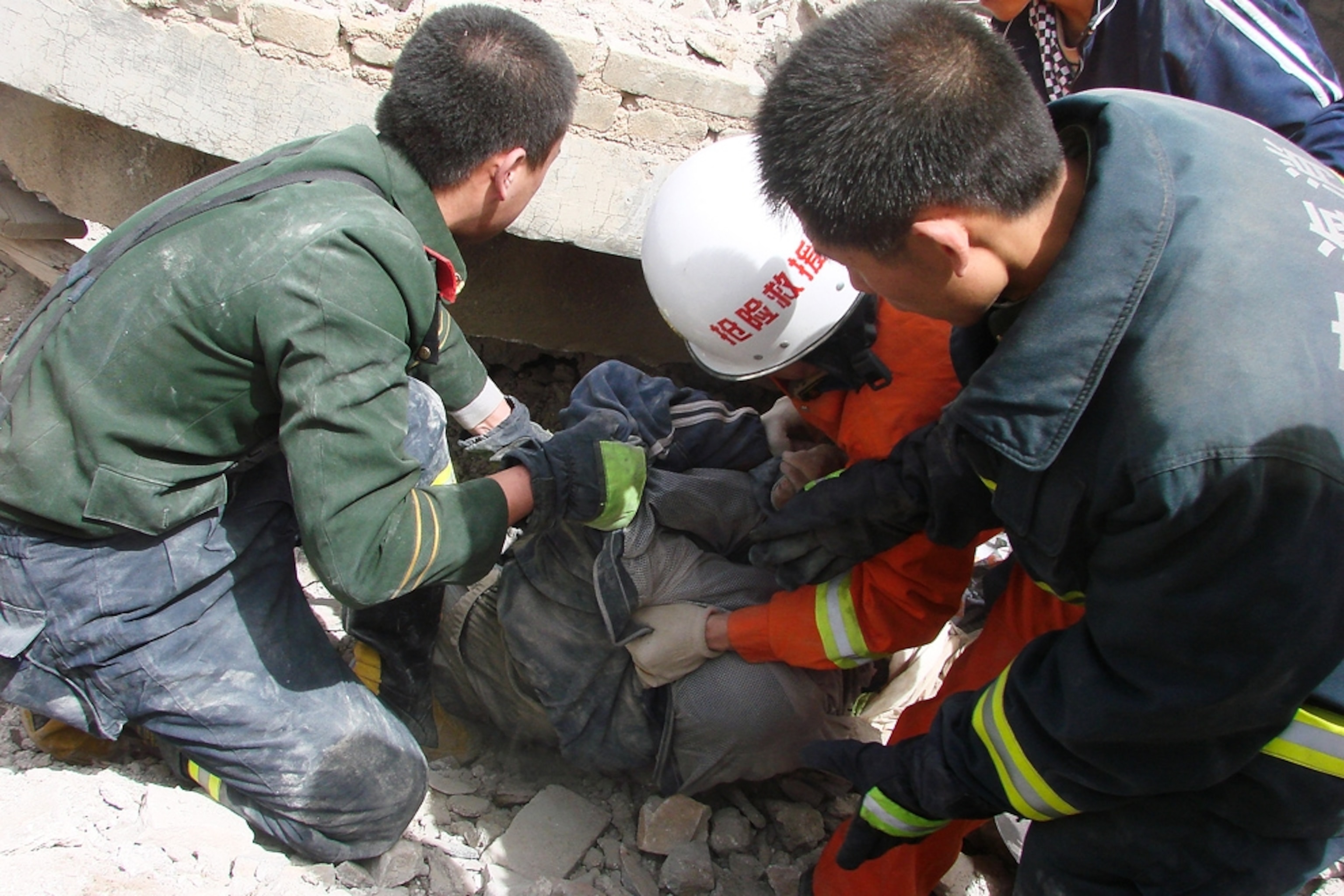 Picture of rescuers and a survivor of the China earthquake today.