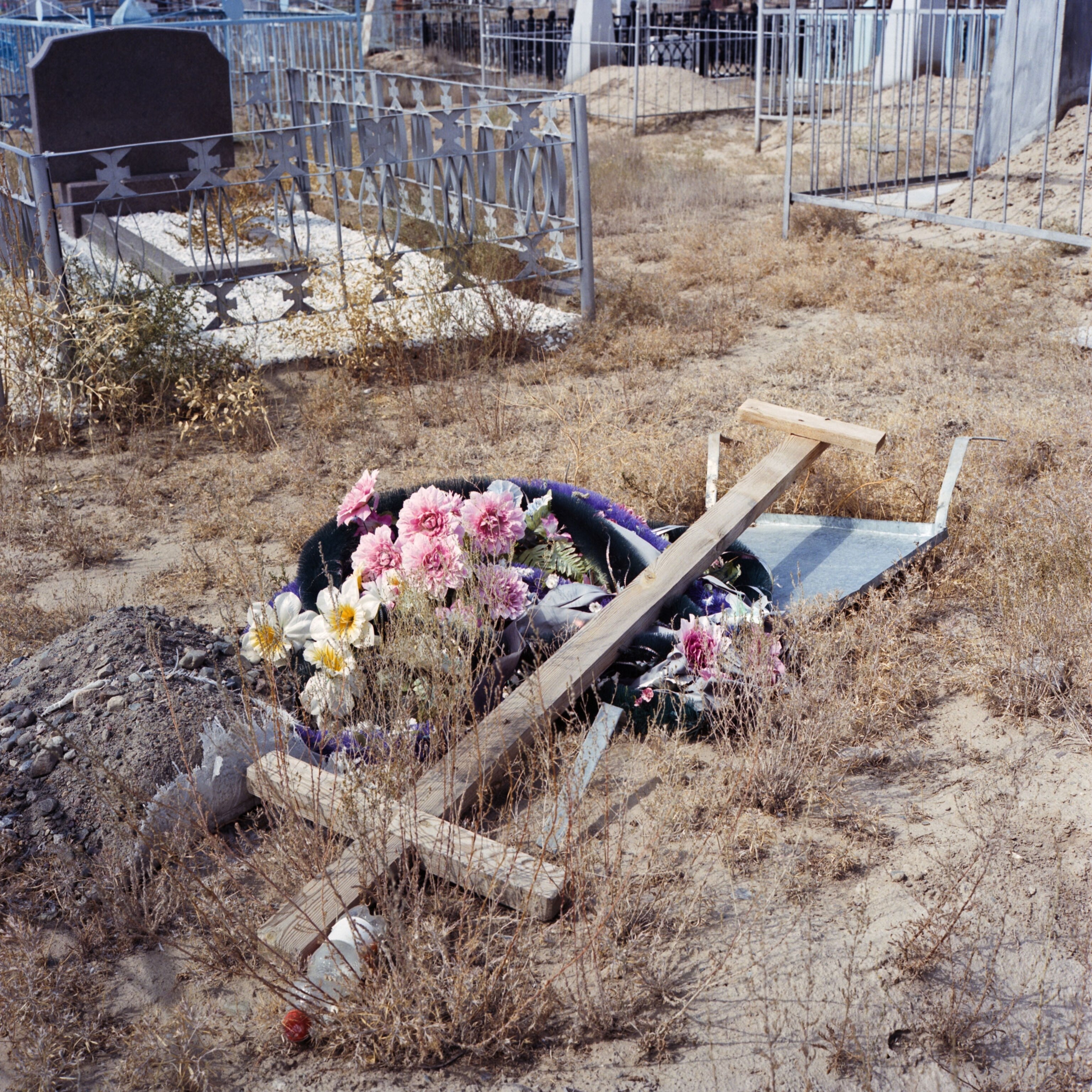 a fallen cross in Bastobe hill, one of the first Korean settlements in Kazakhstan