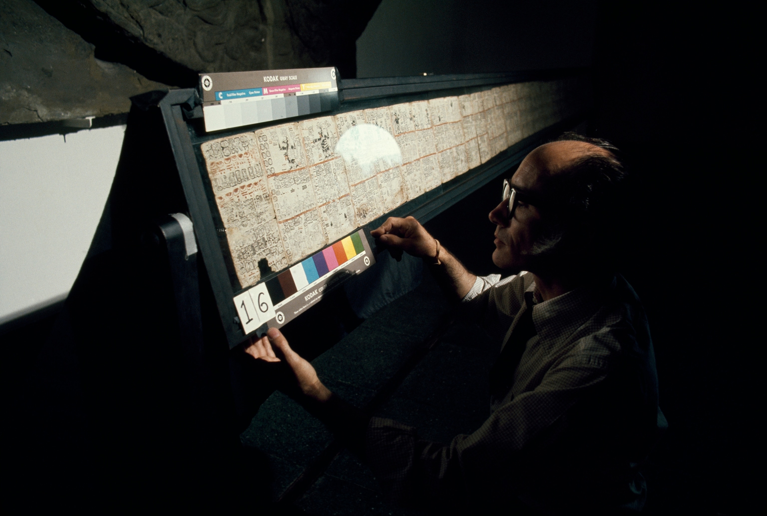 Here, in Madrid's Museo de America, GEOGRAPHIC photog rapher Victor Boswell uses a guide to assure accurate color in the four-page reproduction that follows.