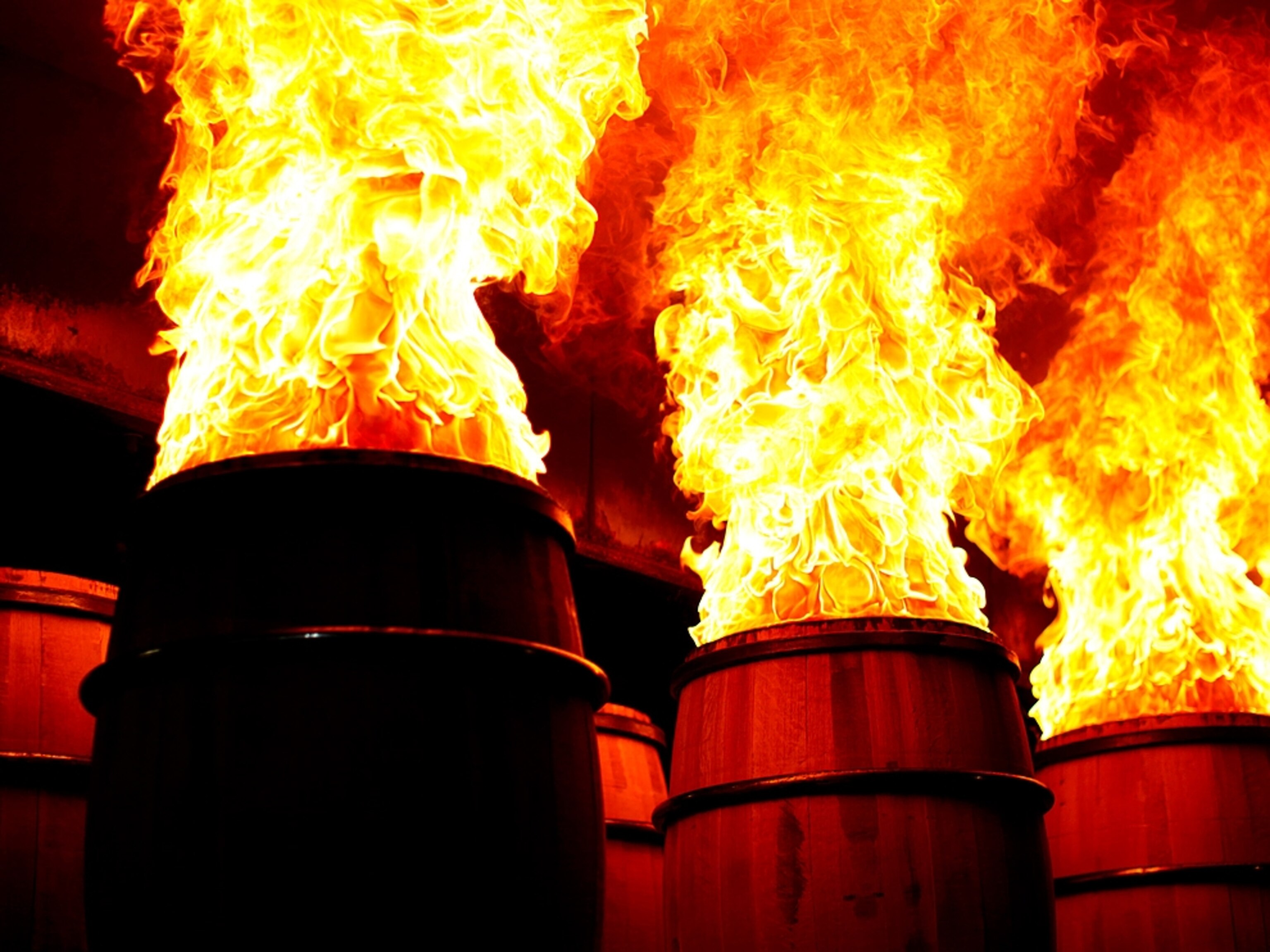 new bourbon barrels being charred