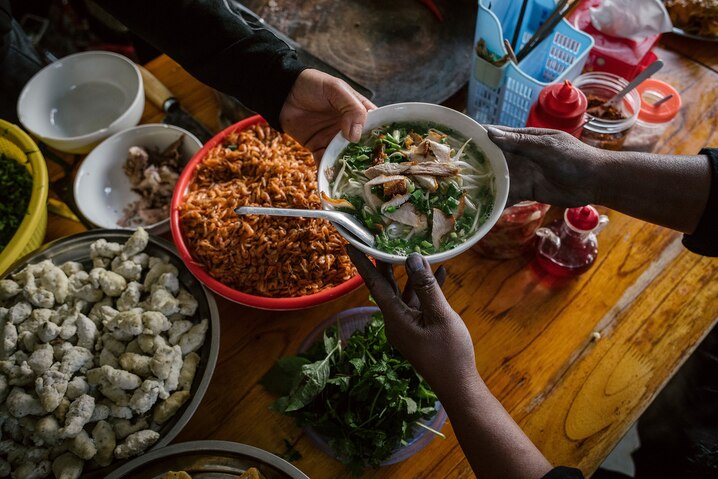 Steaming bowl of pho at a Hanoi street food stall — Vietnam food and culture tour