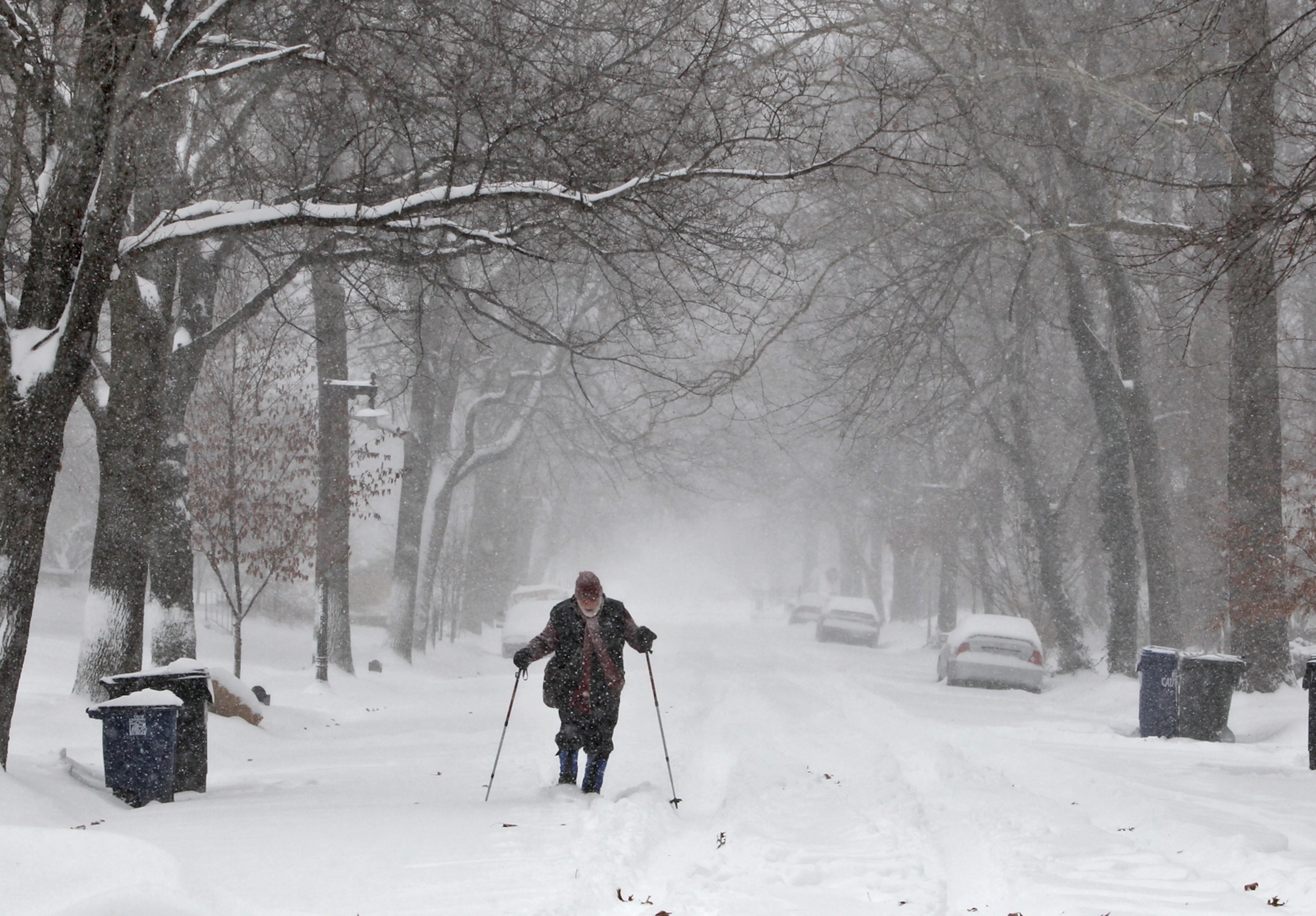 man cross country skiing on a street in University City, Missouri on January 5