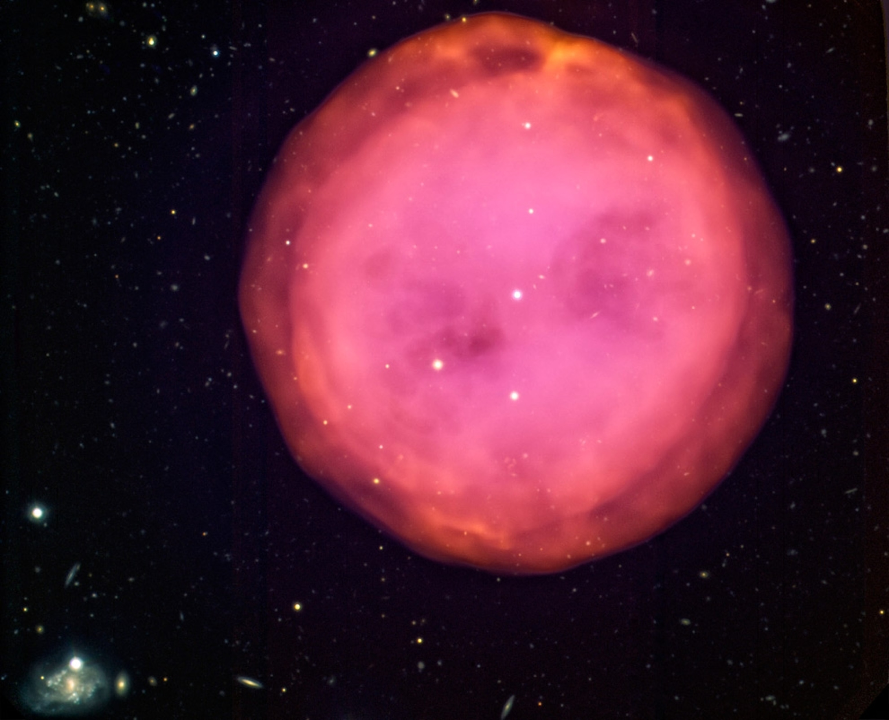 A new picture of the Owl Nebula looking like a hot-pink gumdrop.