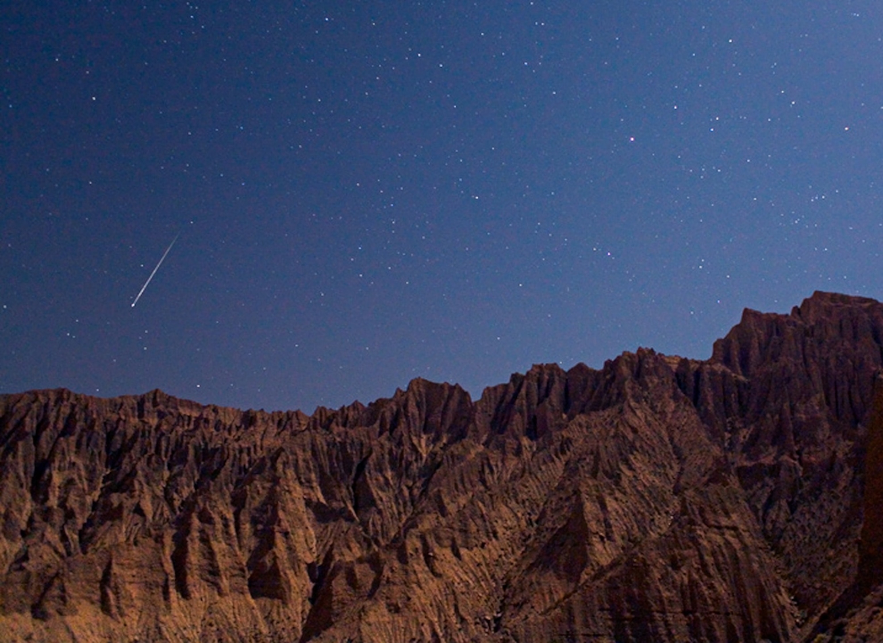 A picture of a Perseid meteor above Iran's Elburz Mountains in an August 13, 2009 photograph.