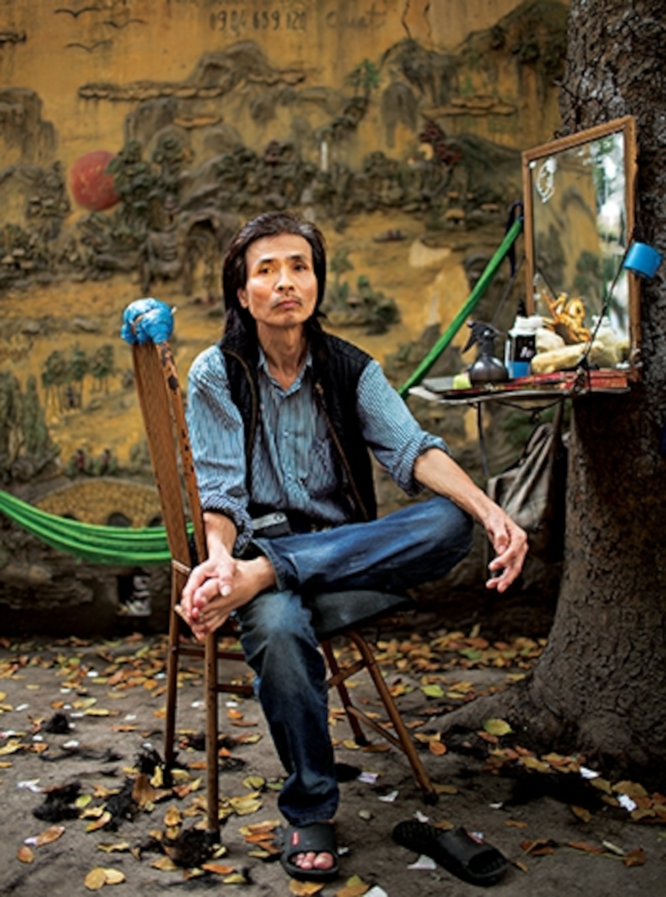 In Hanoi, street barber Bùi Văn Quát not only gives a shave and cut, but also creates art. (Photograph by Katherine Carnow)