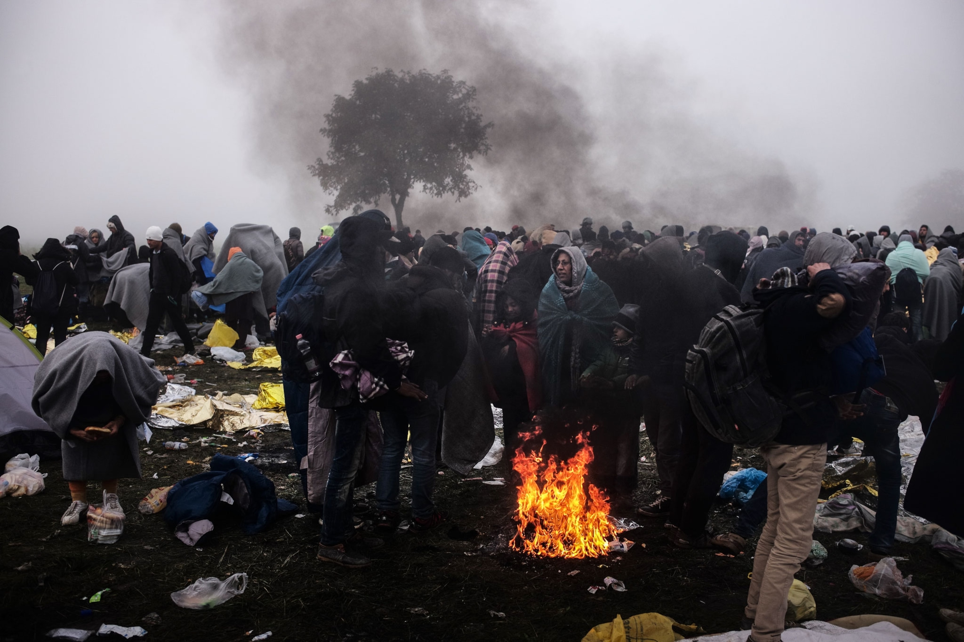 refugees standing in a camp