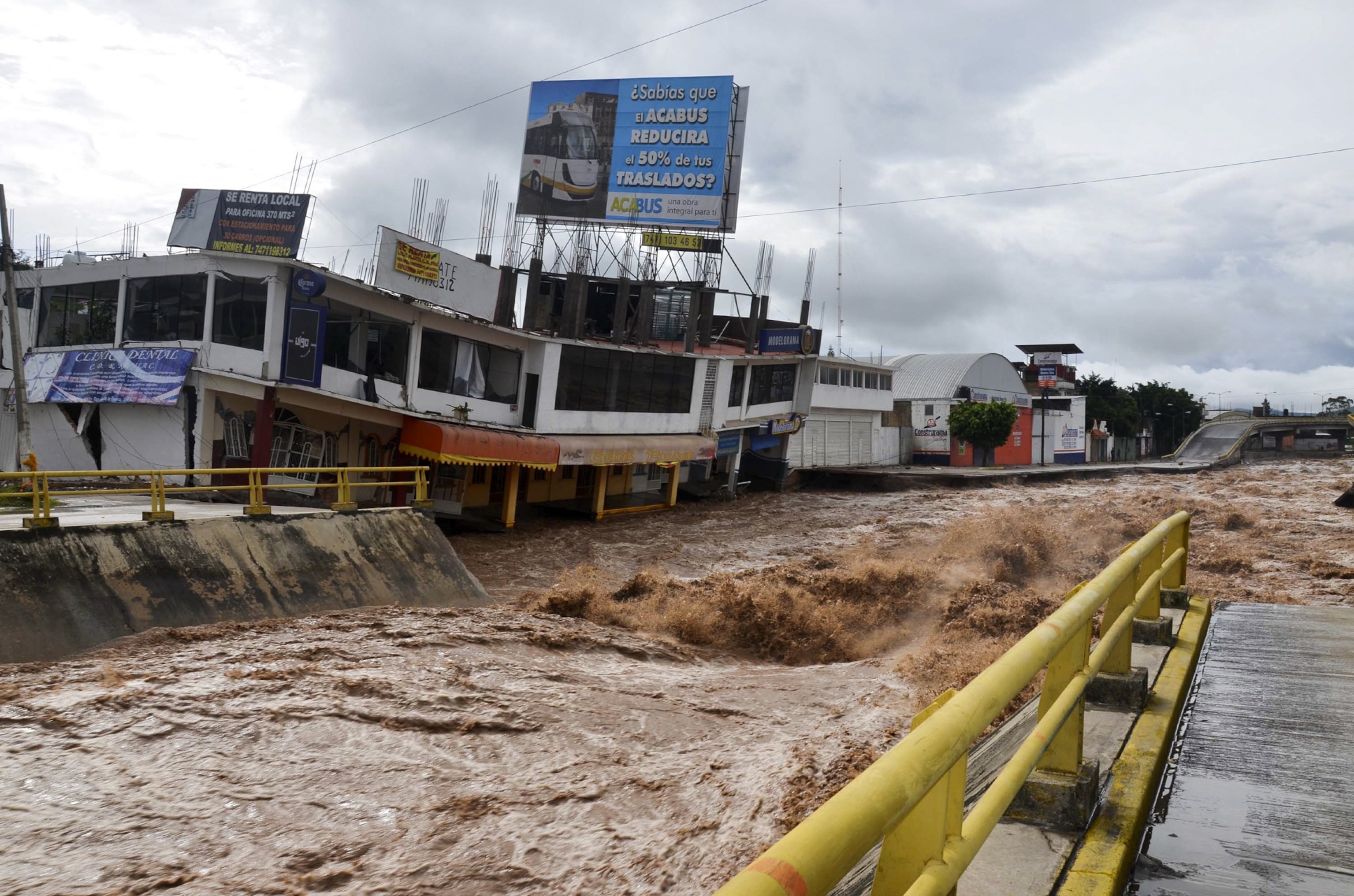 flood waters inundating the town of Chilpancingo after tropical storm Manuel dumped torrential rains on the area